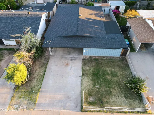 a view of a patio with table and chairs potted plants