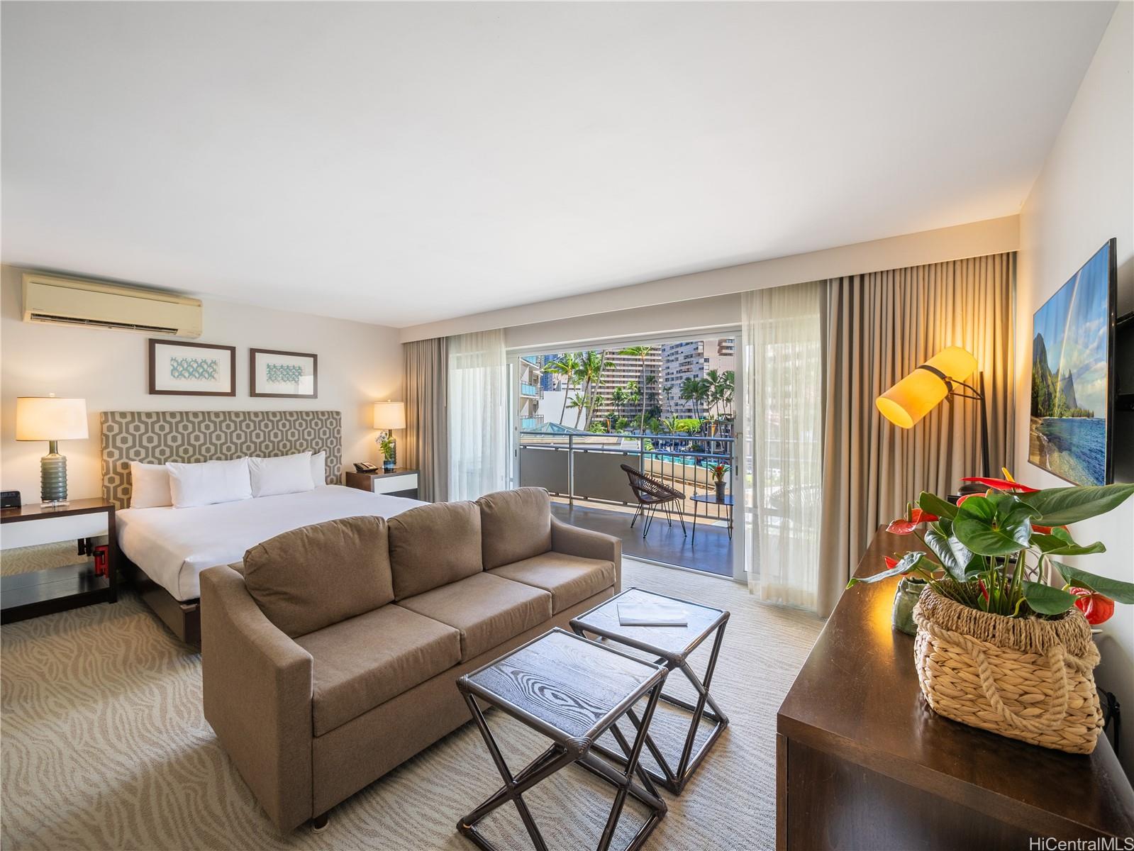 1777 Ala Moana Boulevard, Unit 213 Honolulu, HI 96815 - Photo 1 of 21 a living room with furniture and a potted plant