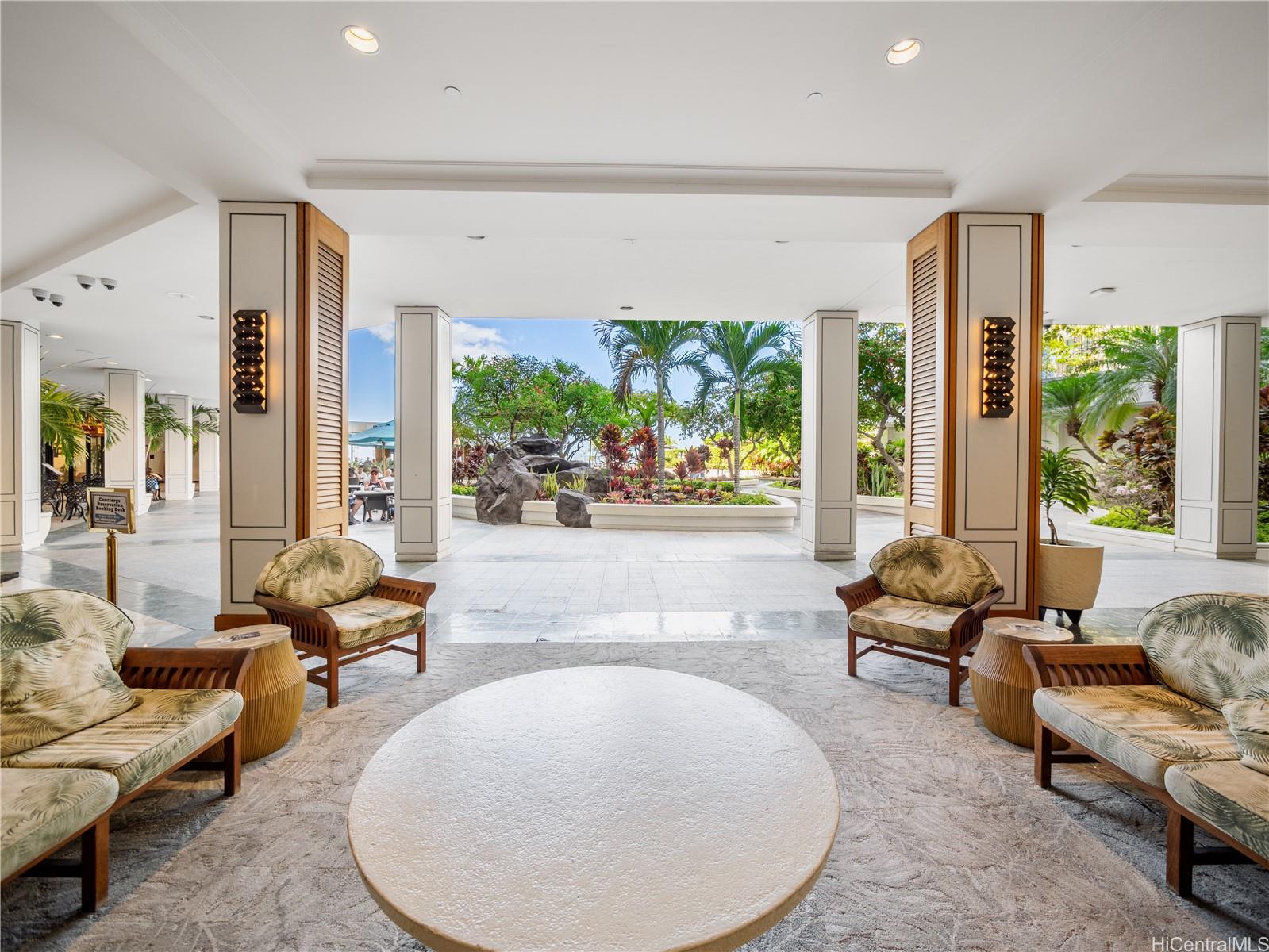 1777 Ala Moana Boulevard, Unit 213 Honolulu, HI 96815 - Photo 13 of 21 a living room with furniture and large windows