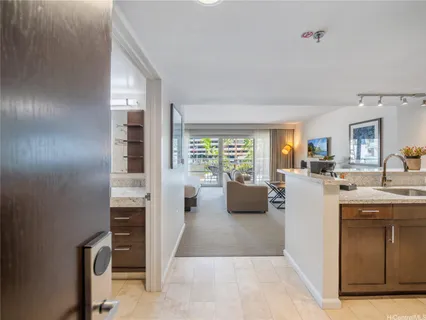 a view of living room kitchen with furniture and outdoor view