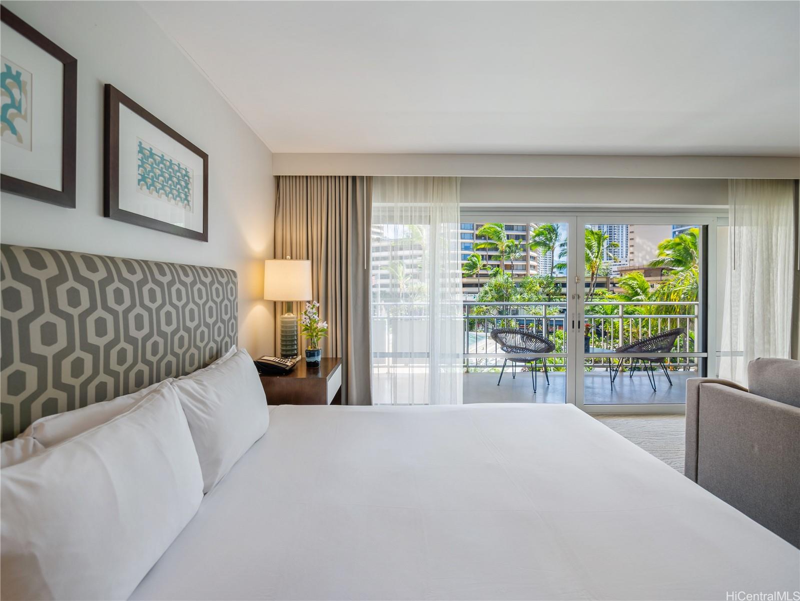 1777 Ala Moana Boulevard, Unit 213 Honolulu, HI 96815 - Photo 7 of 21 a bedroom with a large bed and a large window