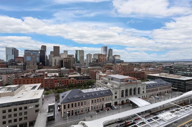 a large kitchen with kitchen island granite countertop a sink and a stove top oven