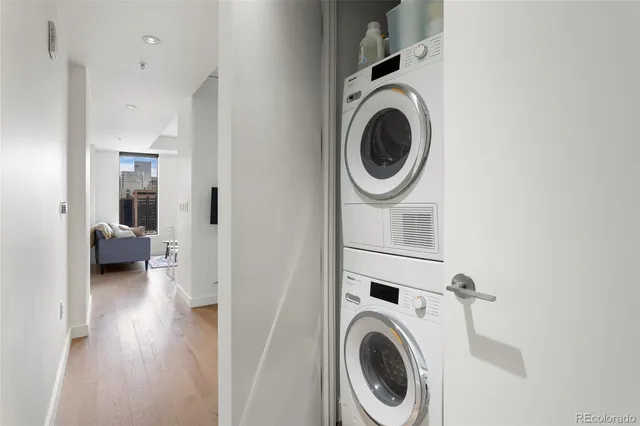 a view of a hallway with washer and dryer