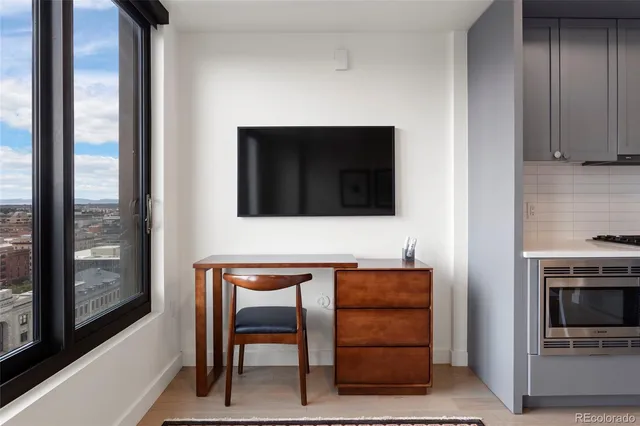 a room with furniture and a flat screen tv