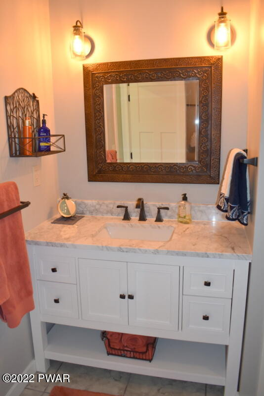 549 Finn Swamp Road Lakeville, PA 18438 - Photo 14 of 35 a bathroom with a sink and a mirror