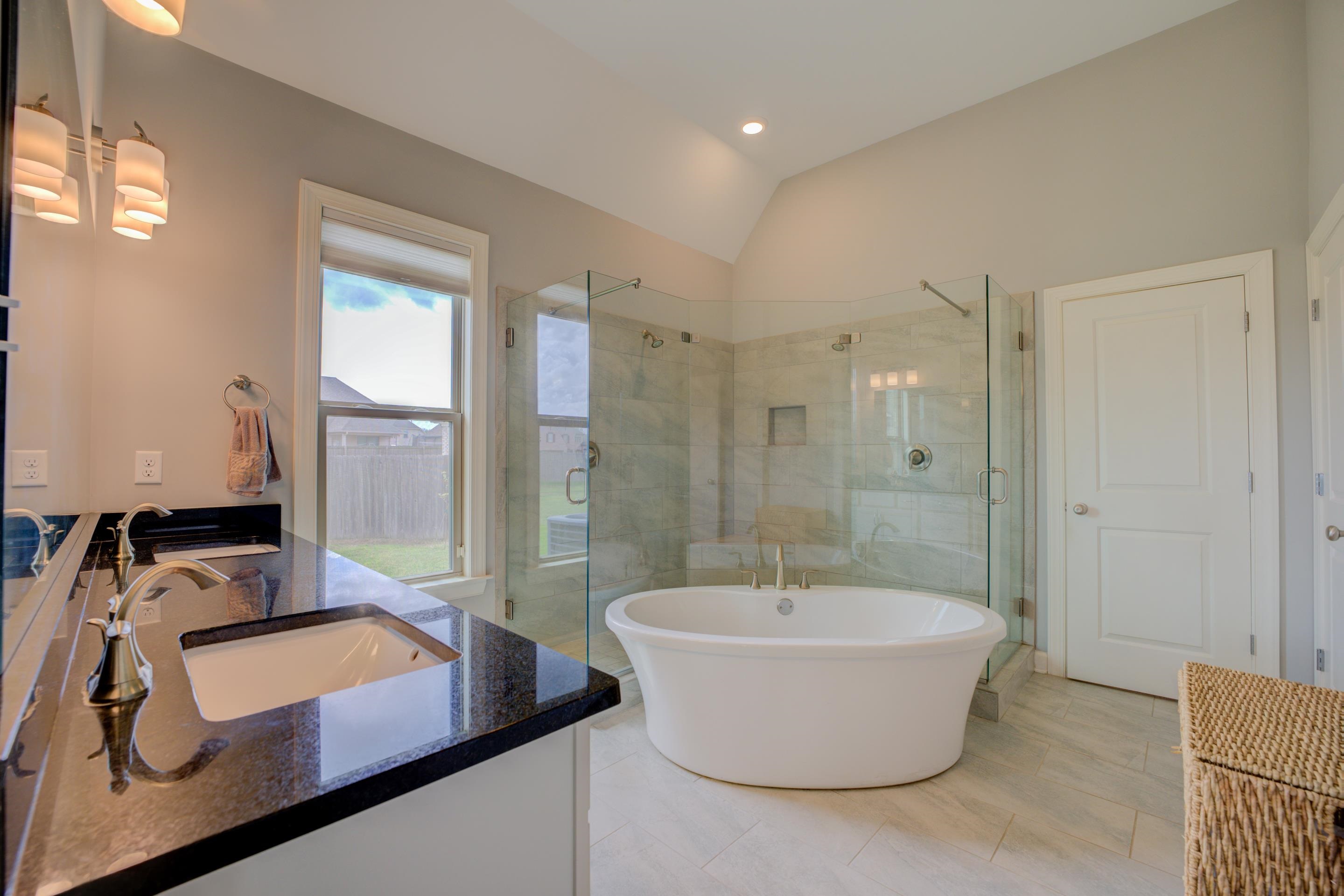 6374 Rutherford Circle Arlington, TN 38002 - Photo 19 of 40 Lovely primary en-suite with luxury bath. Featuring a soaker tub, walk through shower, double sinks and walk-in closet.