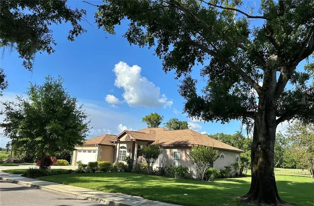 a kitchen with a refrigerator and a stove top oven