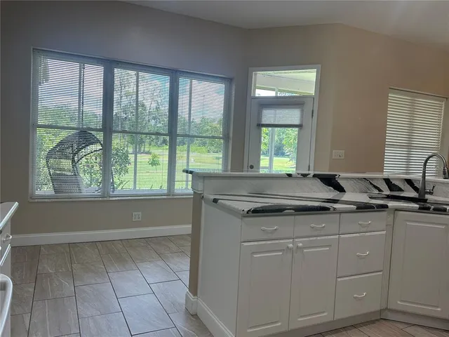 a bathroom with a sink a bathtub and a mirror