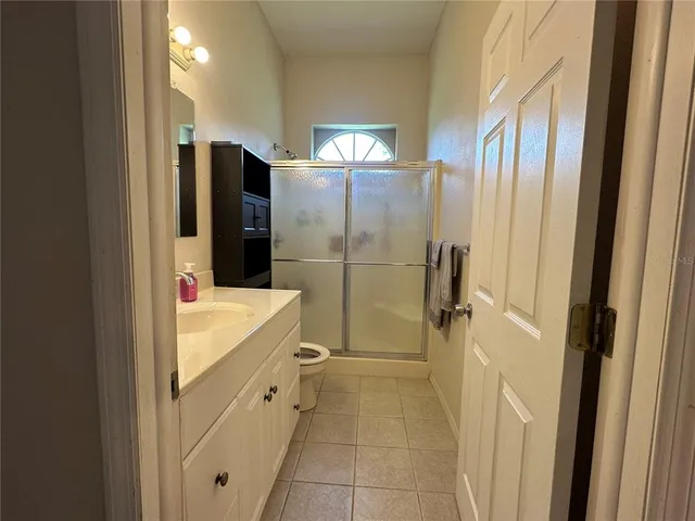 a kitchen with a sink cabinets and stainless steel appliances