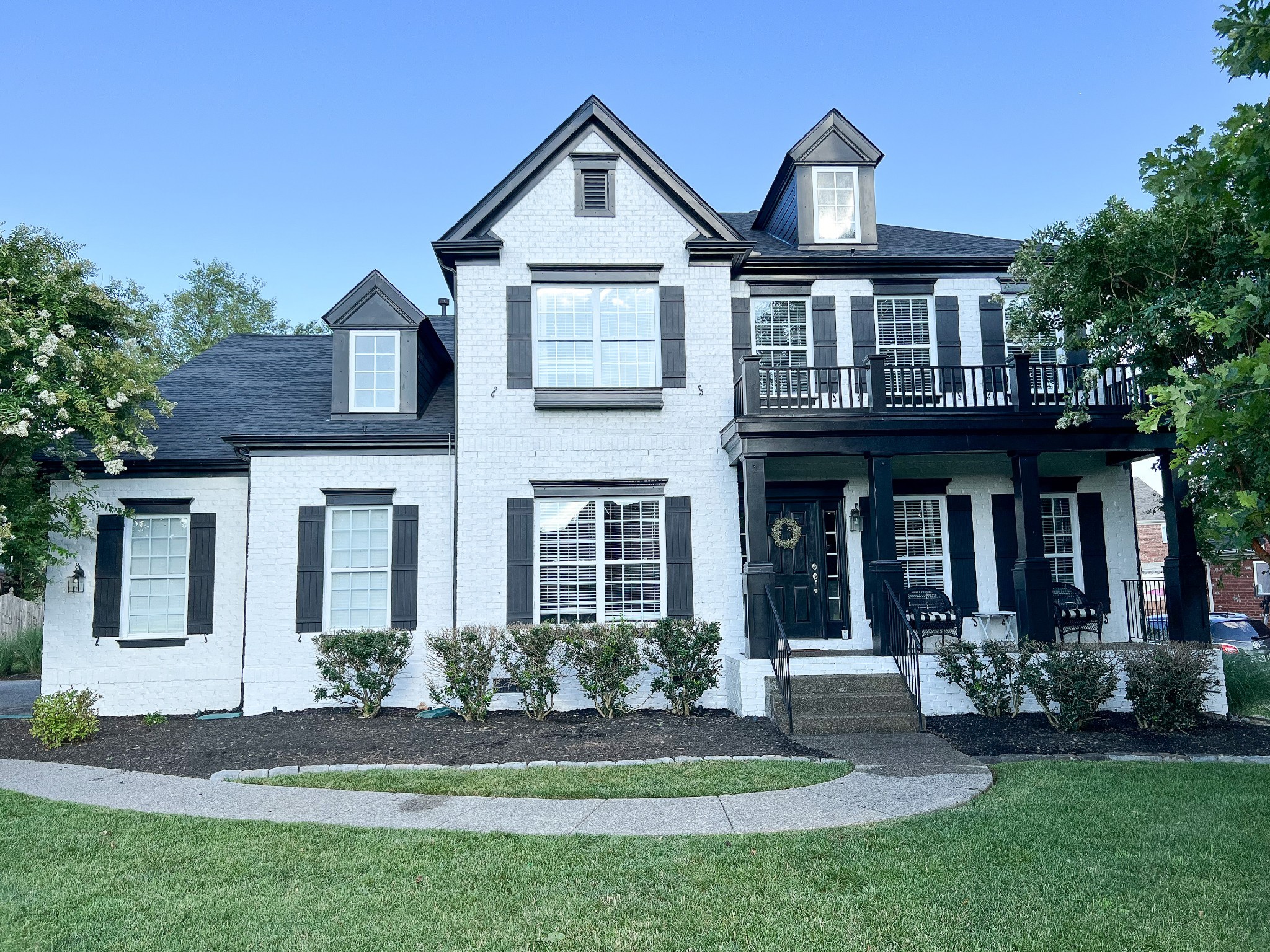 front view of a house with a yard