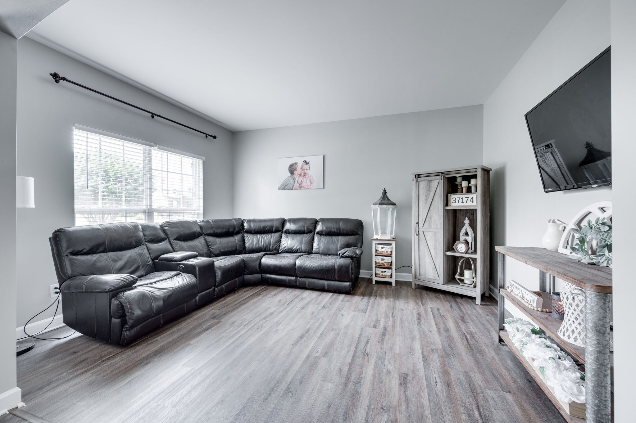 2047 Belshire Way Spring Hill, TN 37174 - Photo 12 of 54 a living room with furniture and a flat screen tv