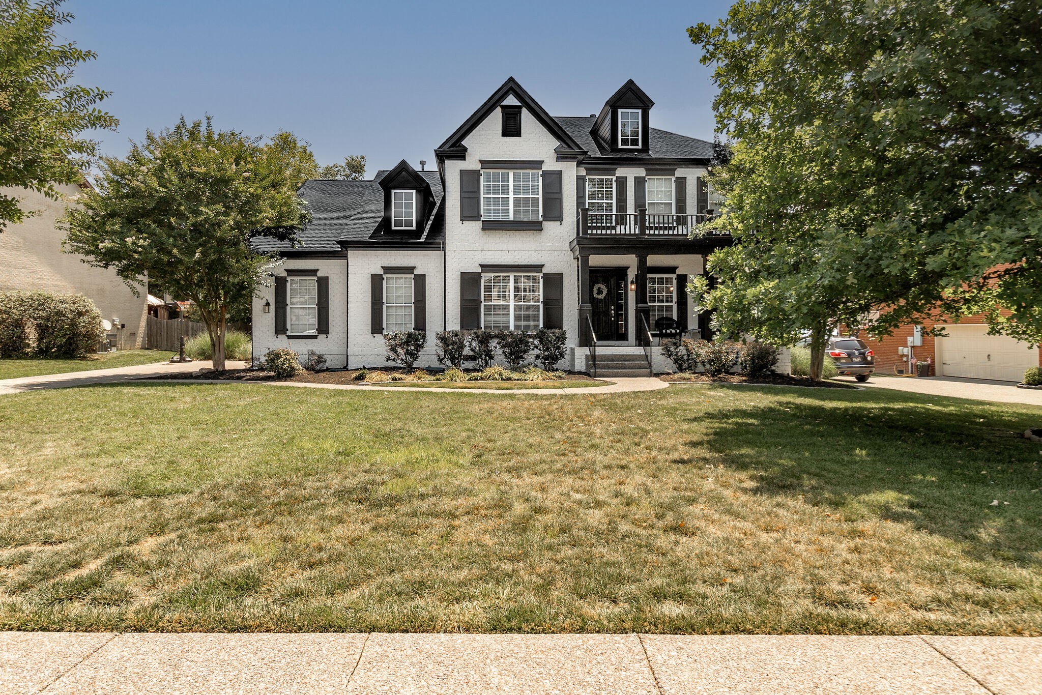 2047 Belshire Way Spring Hill, TN 37174 - Photo 4 of 54 a front view of a house with a yard
