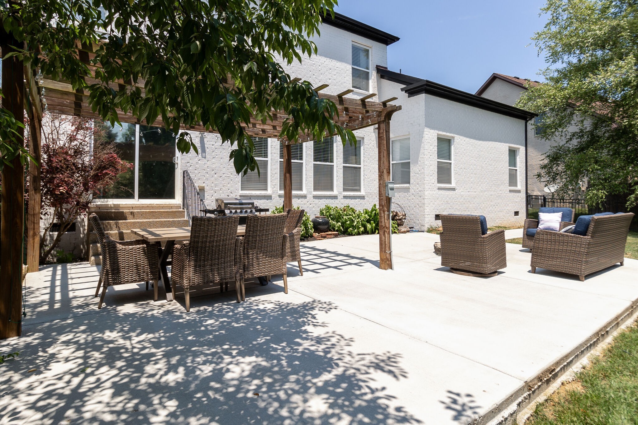 2047 Belshire Way Spring Hill, TN 37174 - Photo 50 of 54 a view of a patio with table and chairs and potted plants