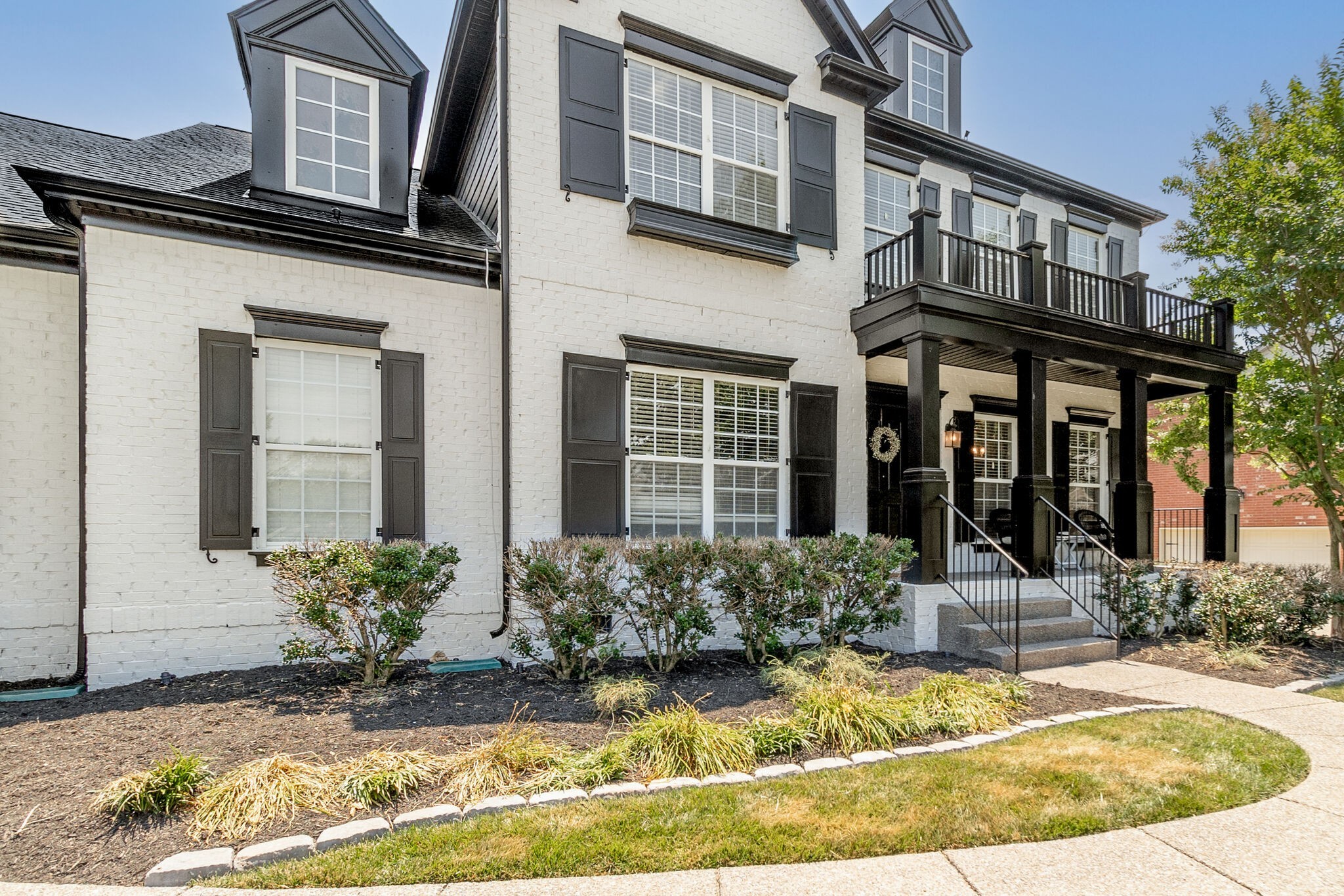 2047 Belshire Way Spring Hill, TN 37174 - Photo 51 of 54 a view of a brick house with potted plants