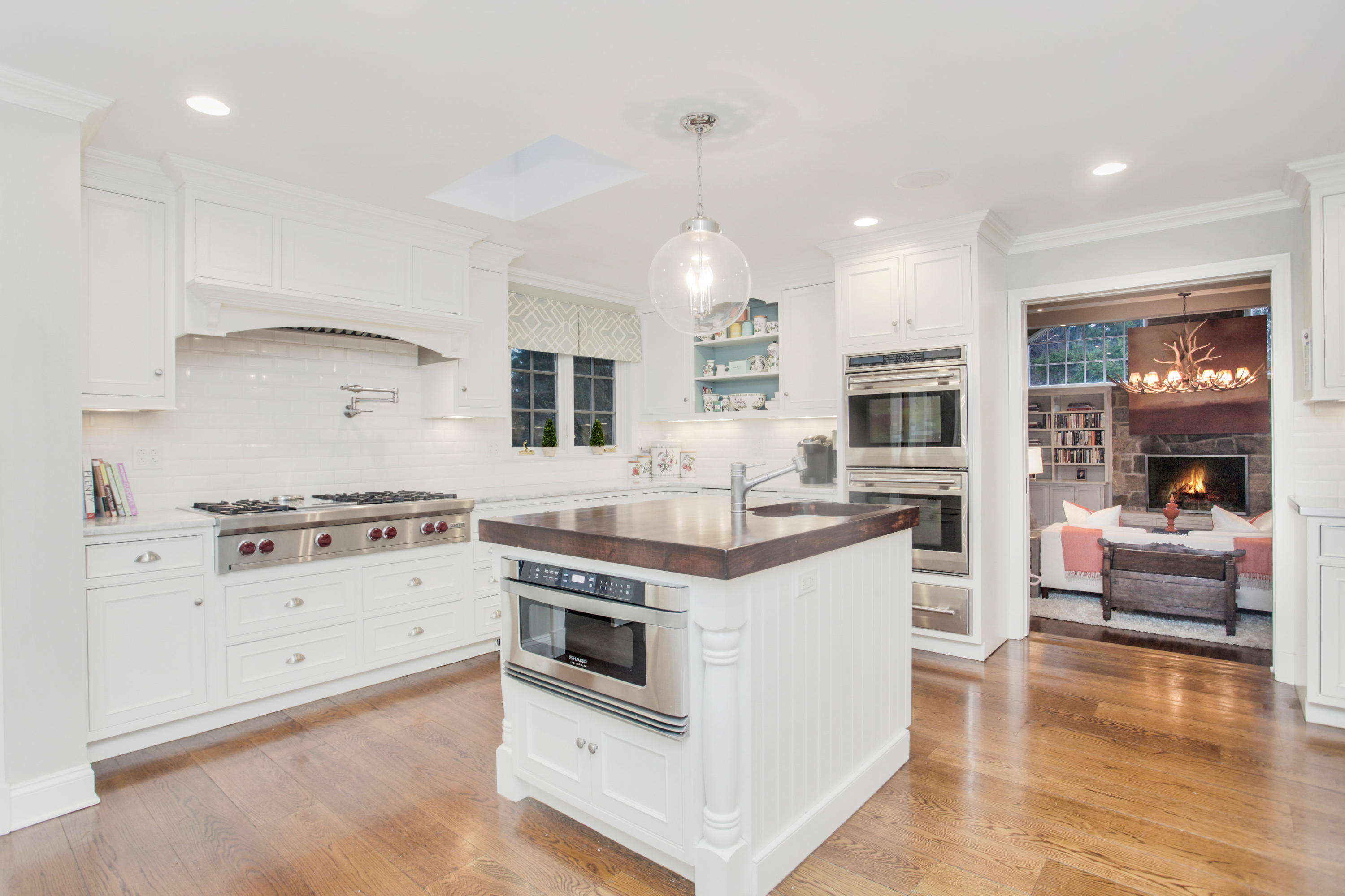 6 Hummingbird Lane Darien, CT 06820 - Photo 12 of 35 a kitchen with stainless steel appliances granite countertop a stove and a refrigerator