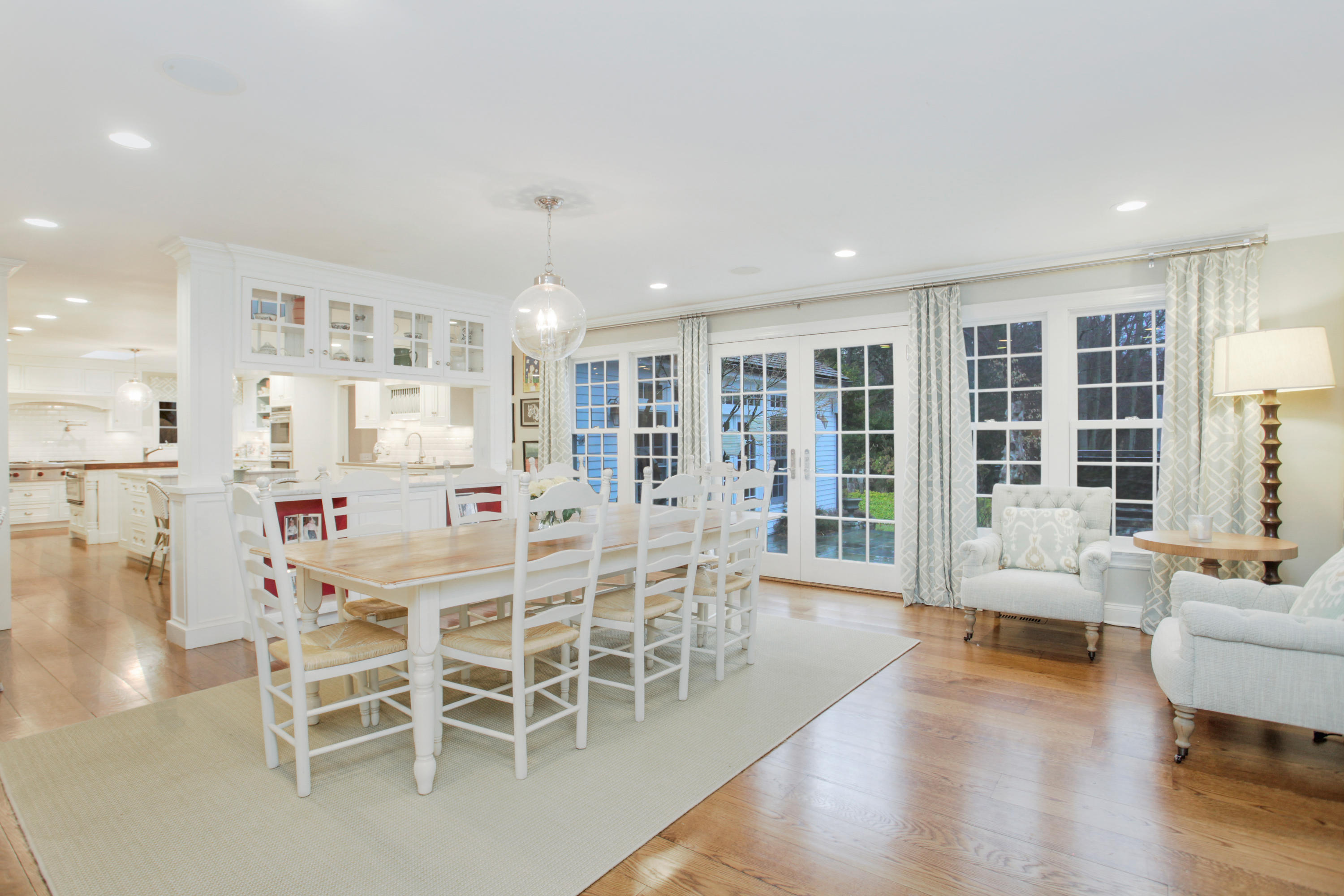 6 Hummingbird Lane Darien, CT 06820 - Photo 13 of 35 a view of a dining room with furniture window and wooden floor