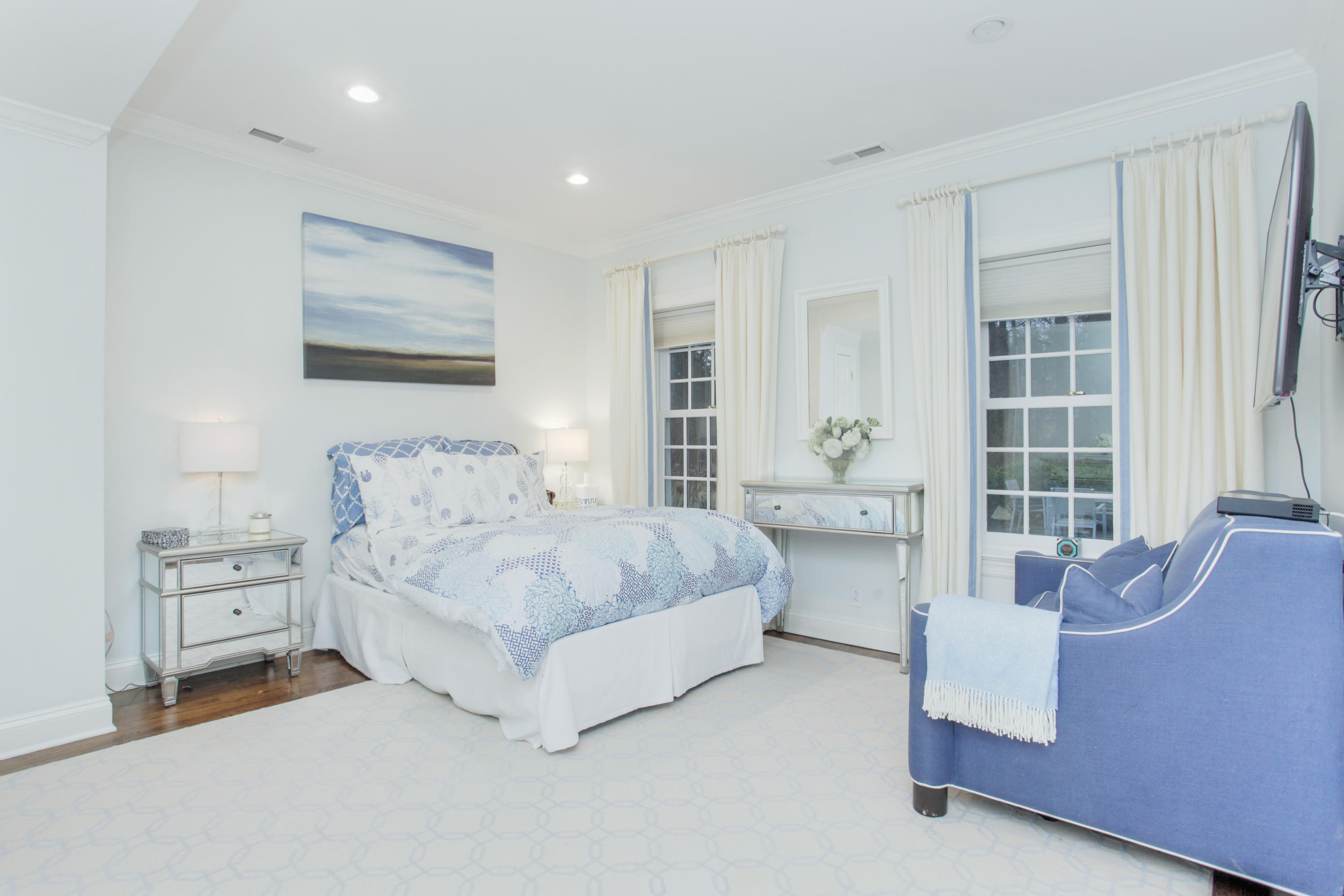 6 Hummingbird Lane Darien, CT 06820 - Photo 18 of 35 a spacious bedroom with a bed and a couch