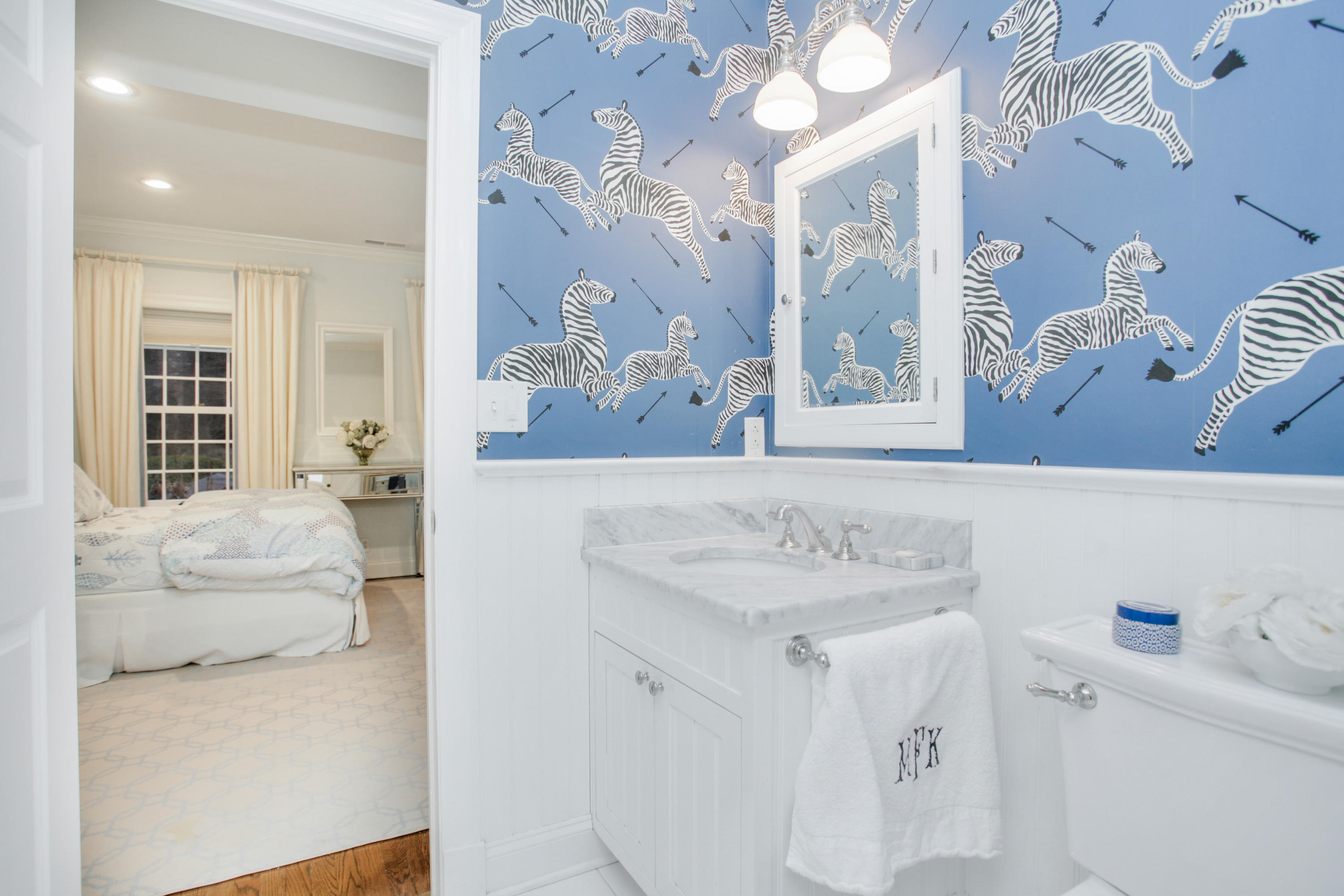 6 Hummingbird Lane Darien, CT 06820 - Photo 19 of 35 a bathroom with a sink vanity and a mirror