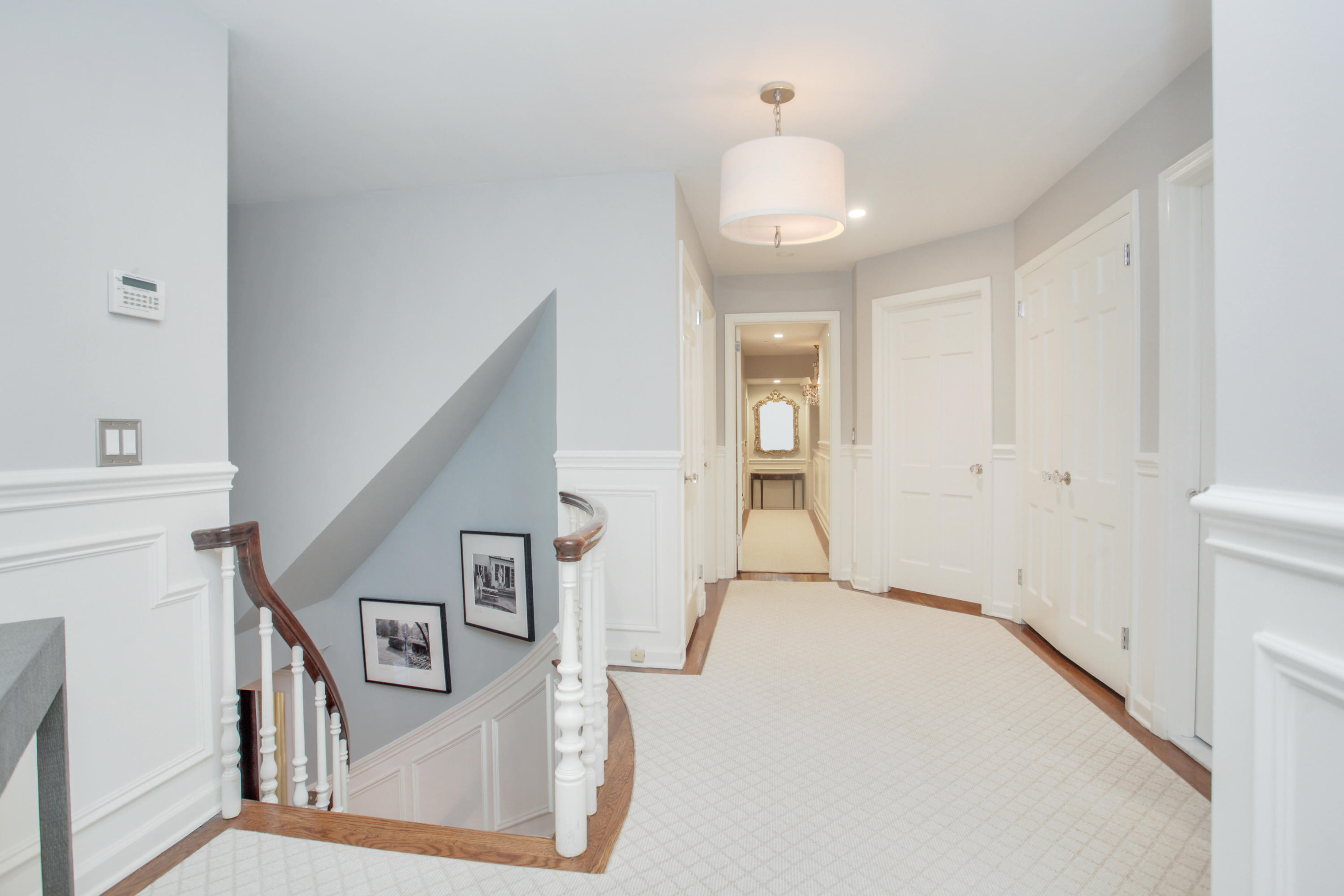 6 Hummingbird Lane Darien, CT 06820 - Photo 20 of 35 a view of a livingroom with wooden floor and stairs