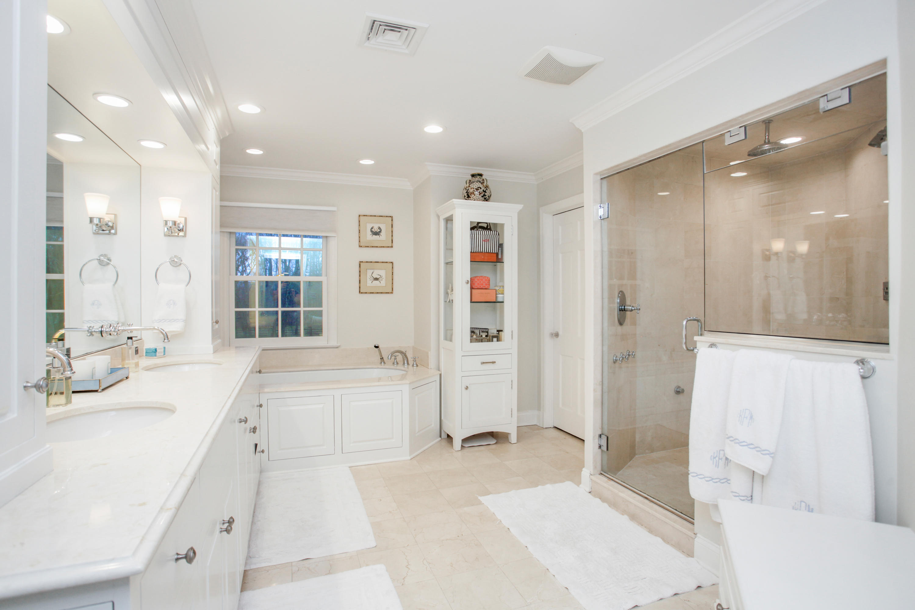 6 Hummingbird Lane Darien, CT 06820 - Photo 22 of 35 a large white bathroom with a tub sink shower and mirror