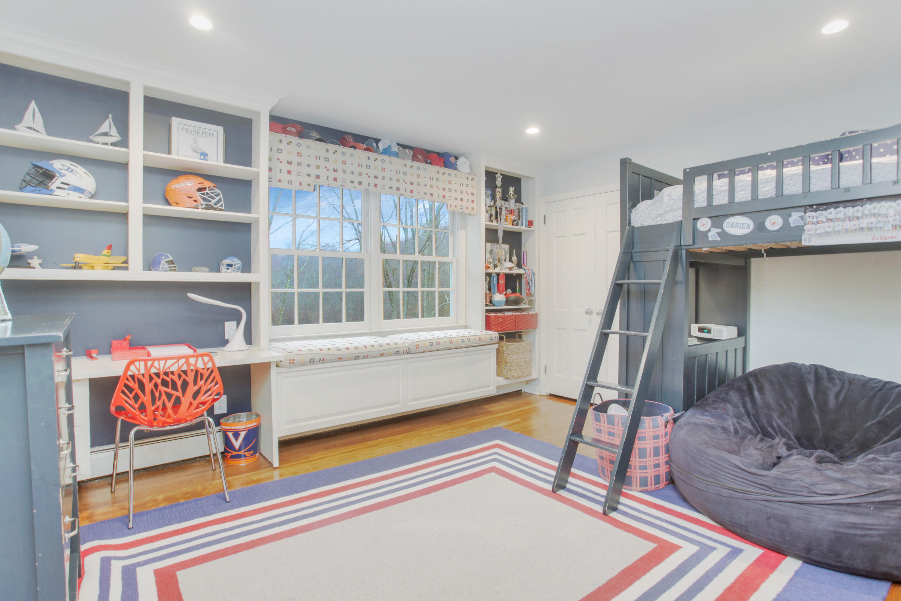 6 Hummingbird Lane Darien, CT 06820 - Photo 26 of 35 a living room with furniture and a floor to ceiling window