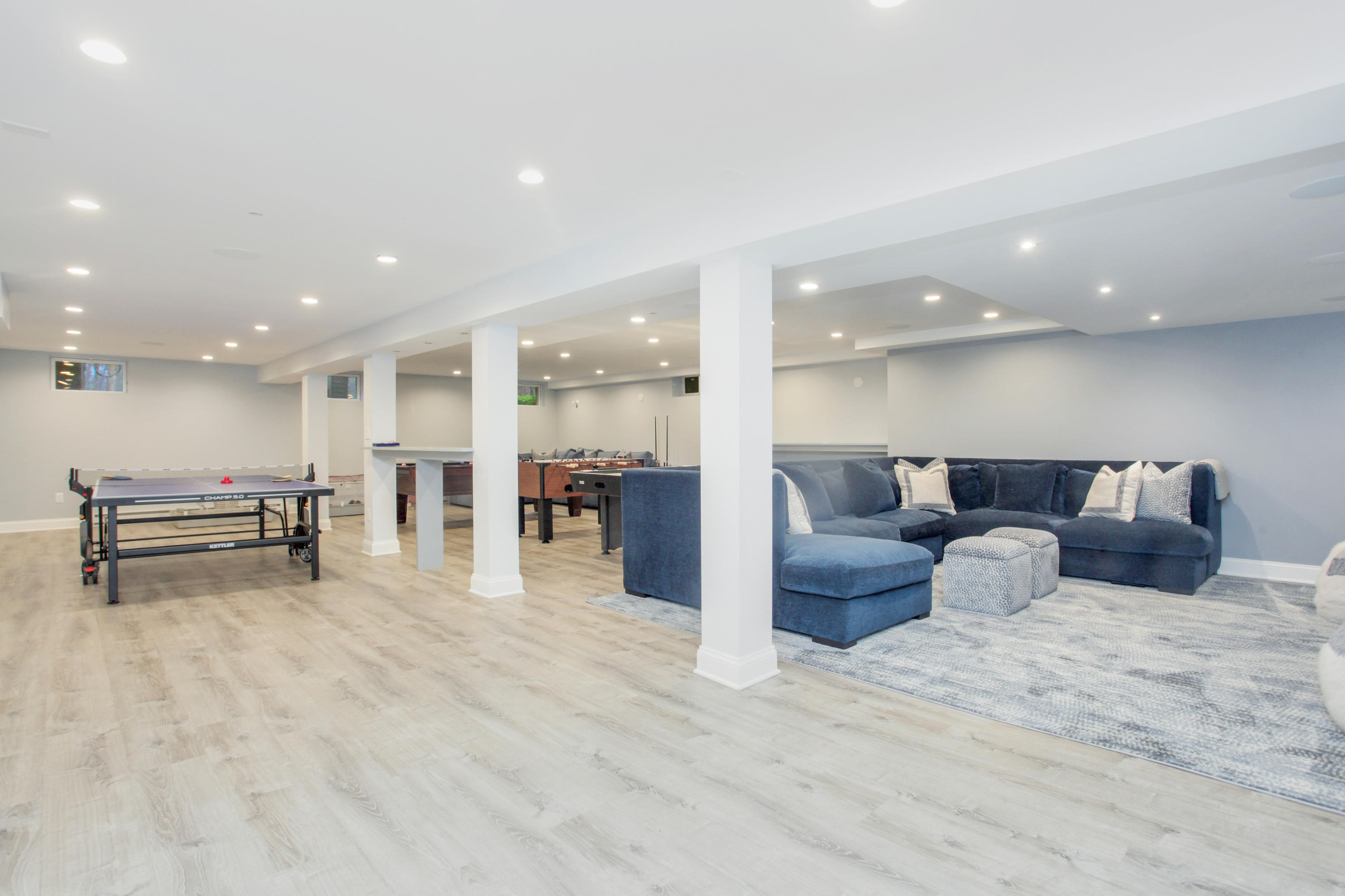 6 Hummingbird Lane Darien, CT 06820 - Photo 29 of 35 a large room with a lot of couches and table