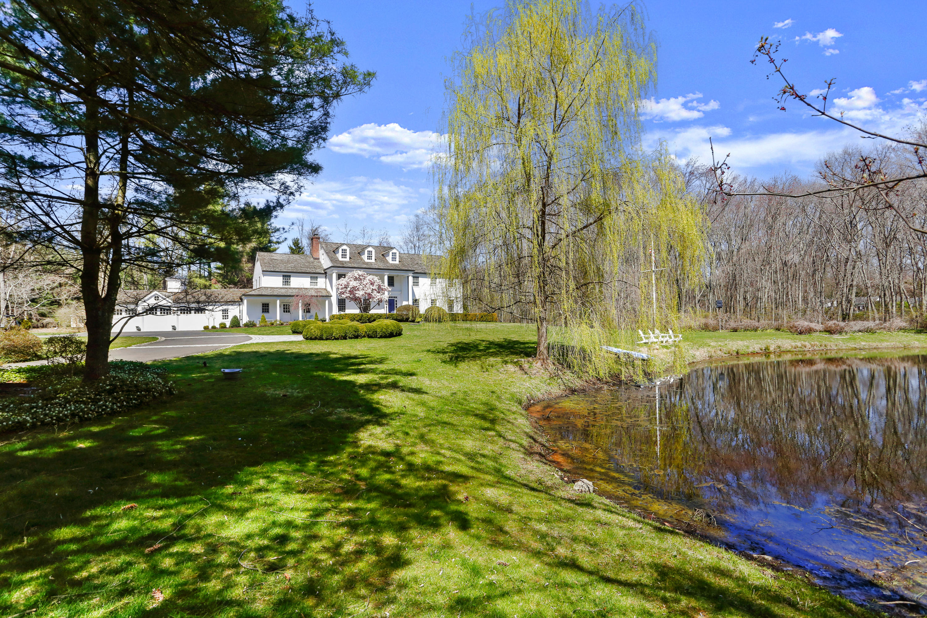 6 Hummingbird Lane Darien, CT 06820 - Photo 32 of 35 a view of a yard with a house