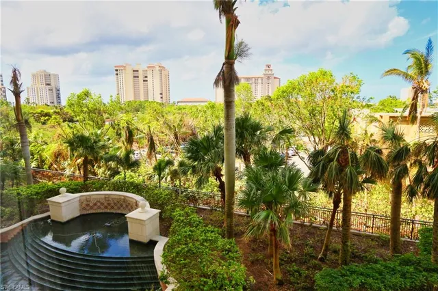 a view of a balcony with chair and table