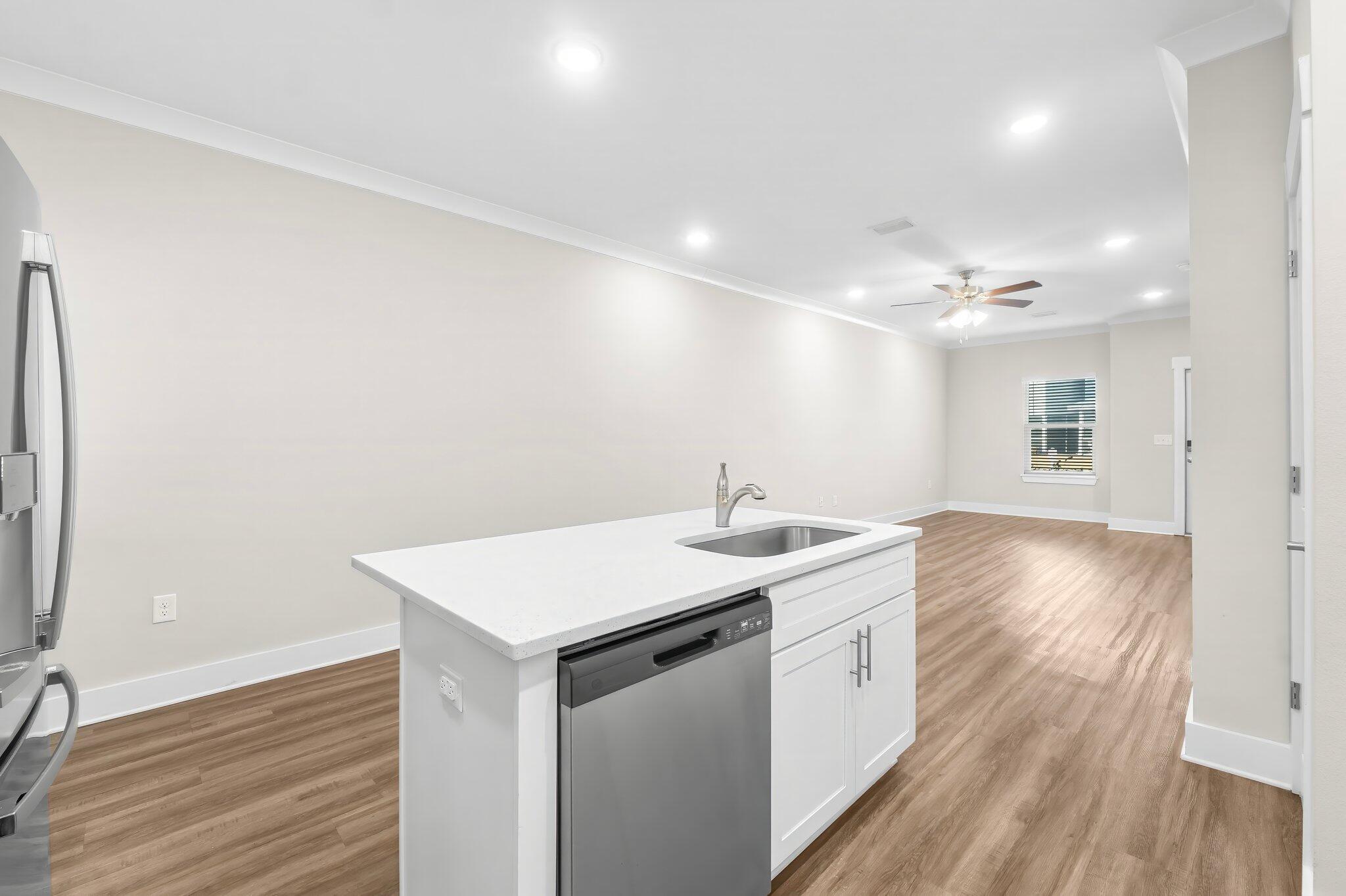 330 North Sand Palm Road, Unit VISTA Freeport, FL 32439 - Photo 15 of 38 a view of a hallway with wooden floor and chandelier