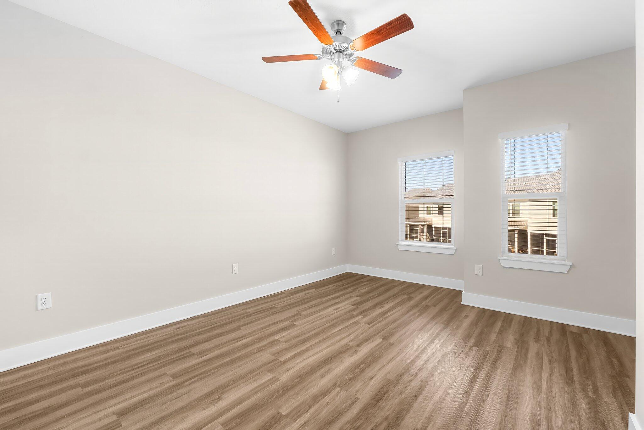 330 North Sand Palm Road, Unit VISTA Freeport, FL 32439 - Photo 19 of 38 wooden floor in an empty room with a window