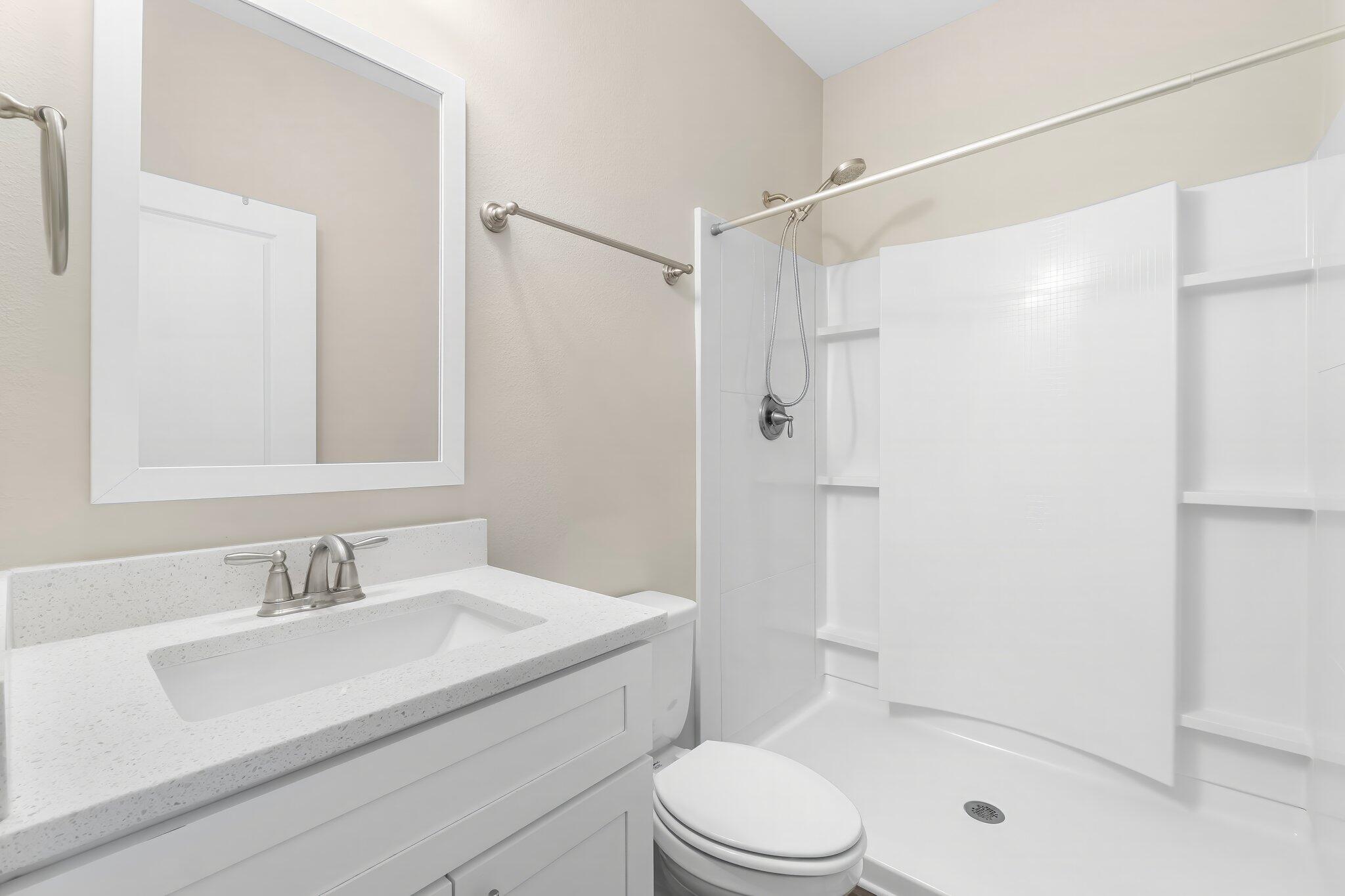 330 North Sand Palm Road, Unit VISTA Freeport, FL 32439 - Photo 21 of 38 a bathroom with a sink a toilet and shower