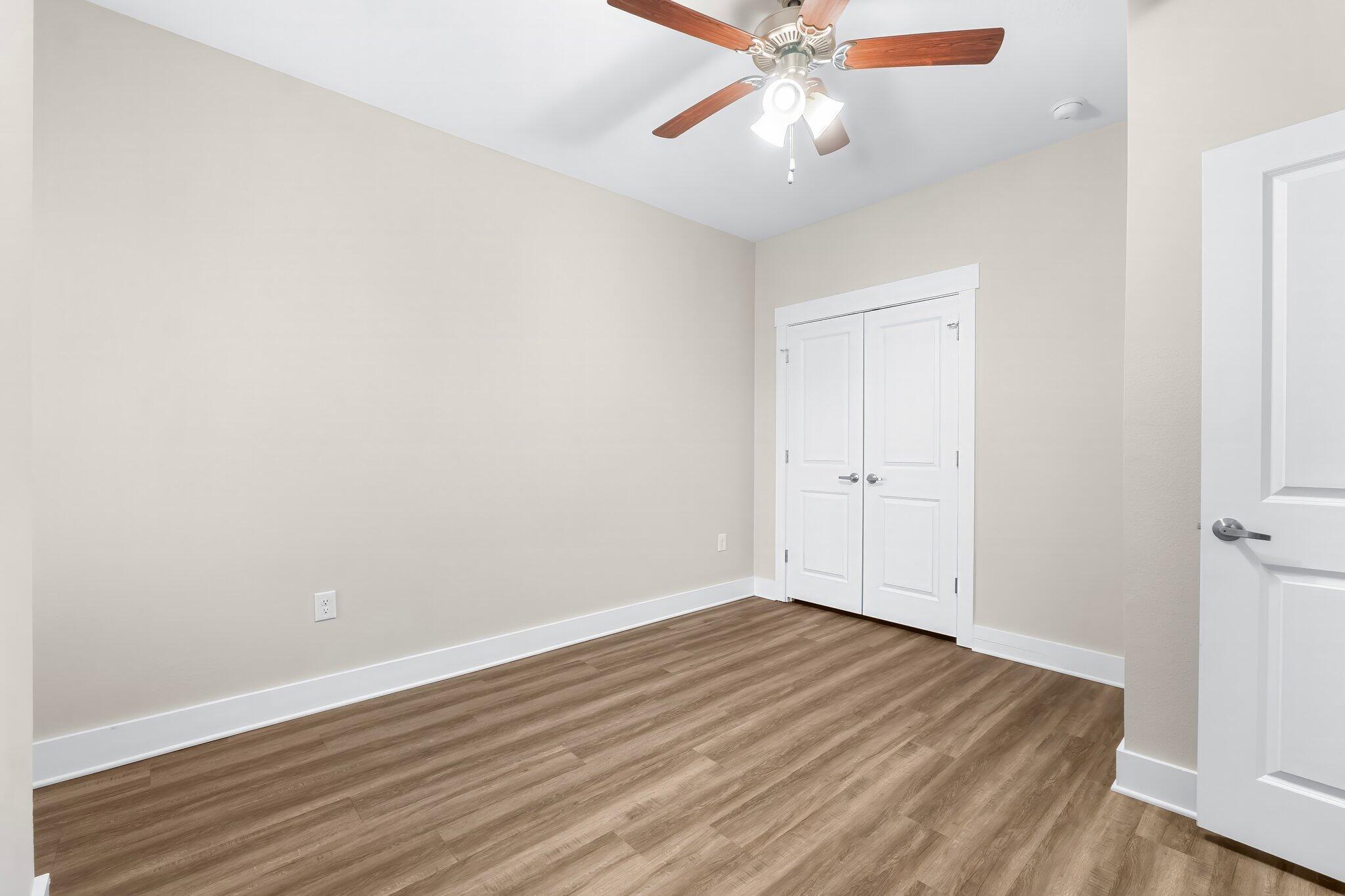 330 North Sand Palm Road, Unit VISTA Freeport, FL 32439 - Photo 22 of 38 a view of an empty room with wooden floor