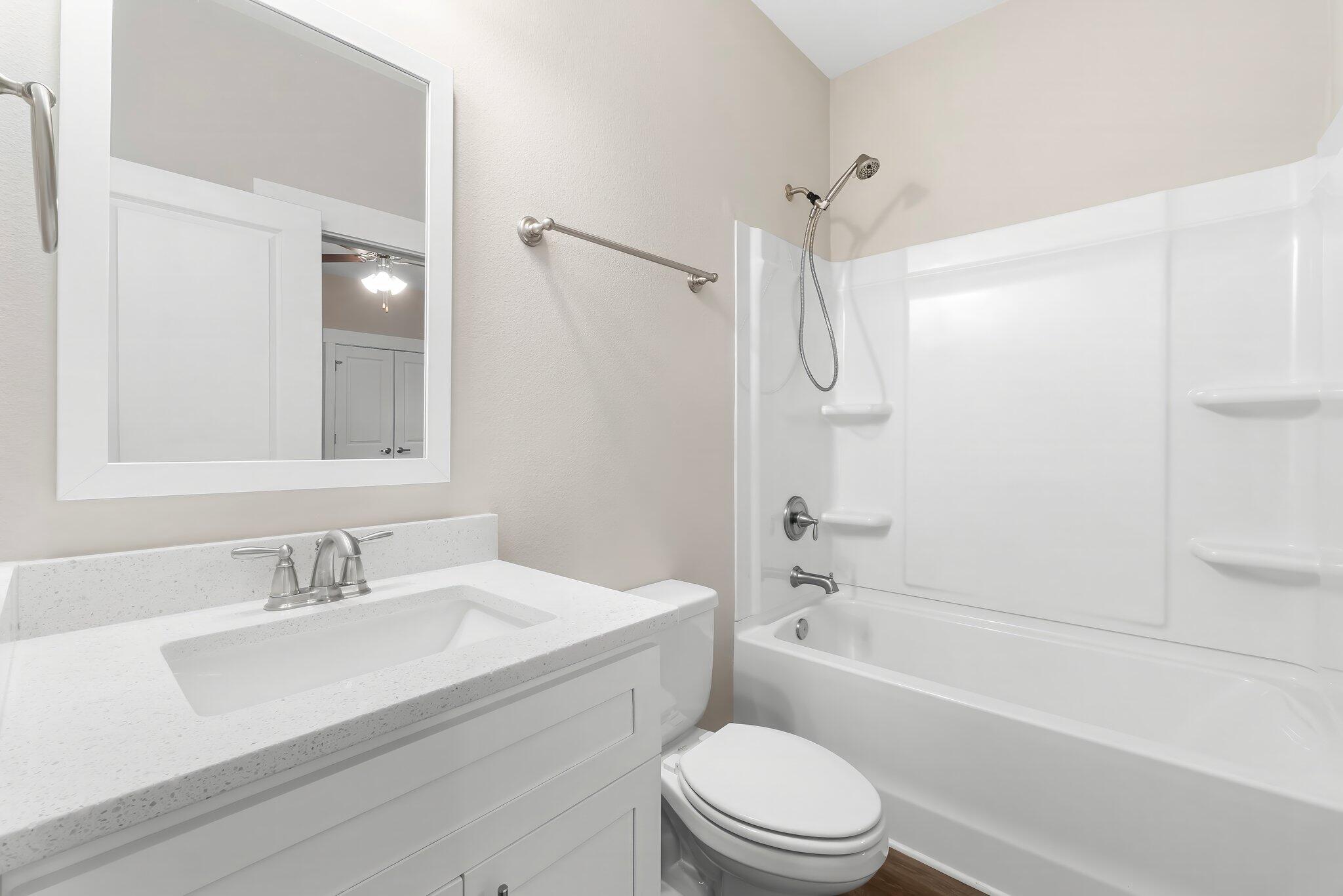 330 North Sand Palm Road, Unit VISTA Freeport, FL 32439 - Photo 24 of 38 a bathroom with a sink a toilet and a bathtub