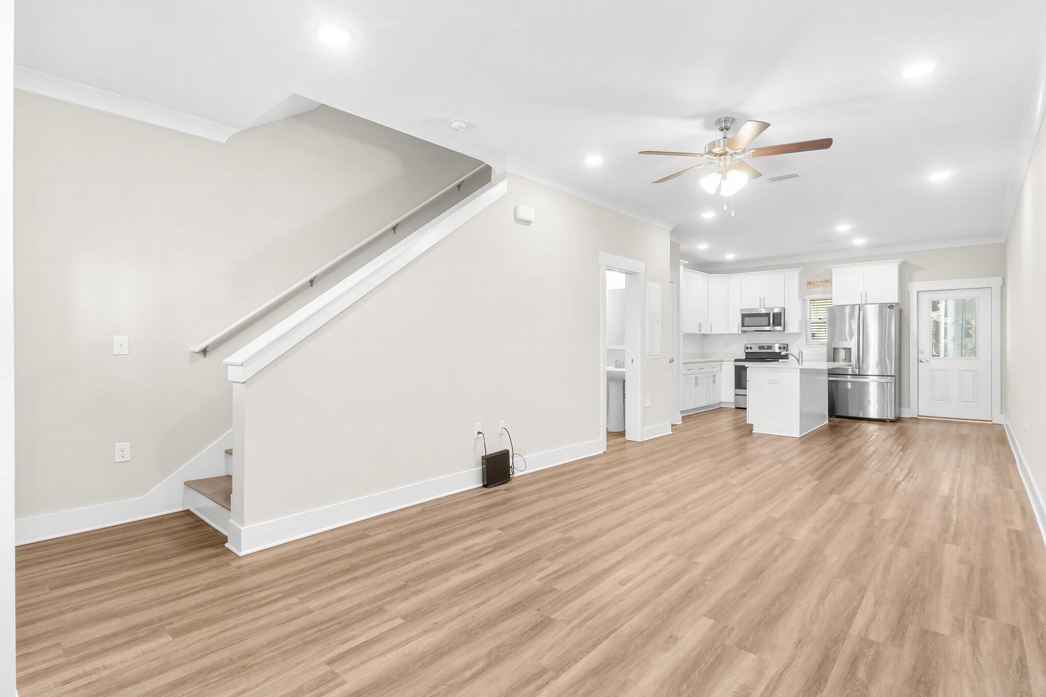 330 North Sand Palm Road, Unit VISTA Freeport, FL 32439 - Photo 8 of 38 a view of a kitchen with wooden floor and a kitchen