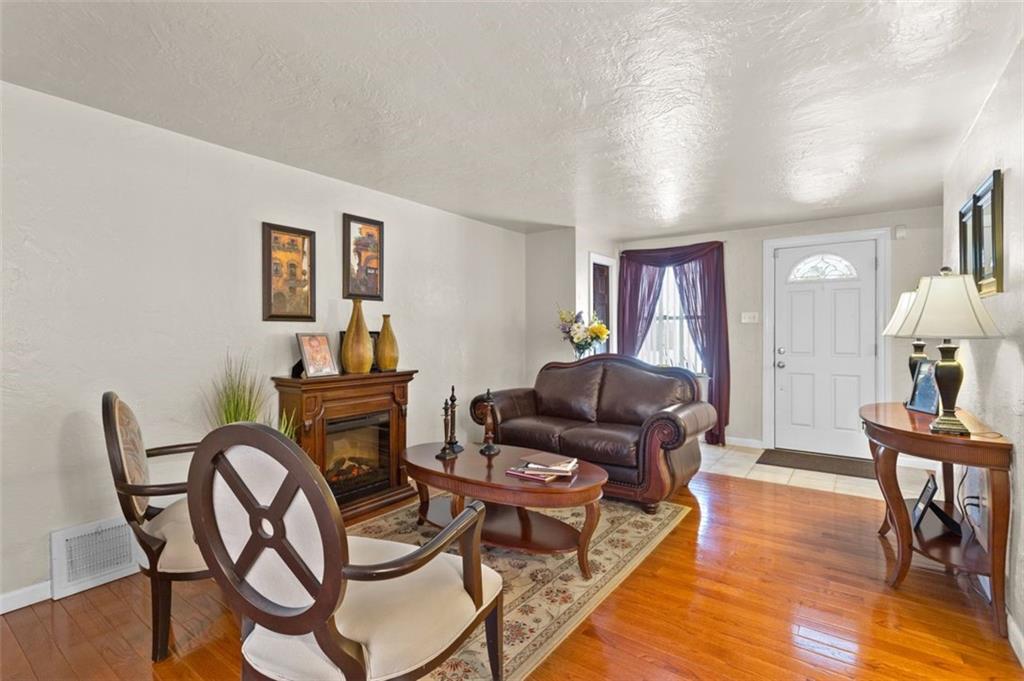 812 Rolling Rock Road Pittsburgh, PA 15234 - Photo 5 of 24 View of the charming electric fireplace as a great focal point in the formal living room.