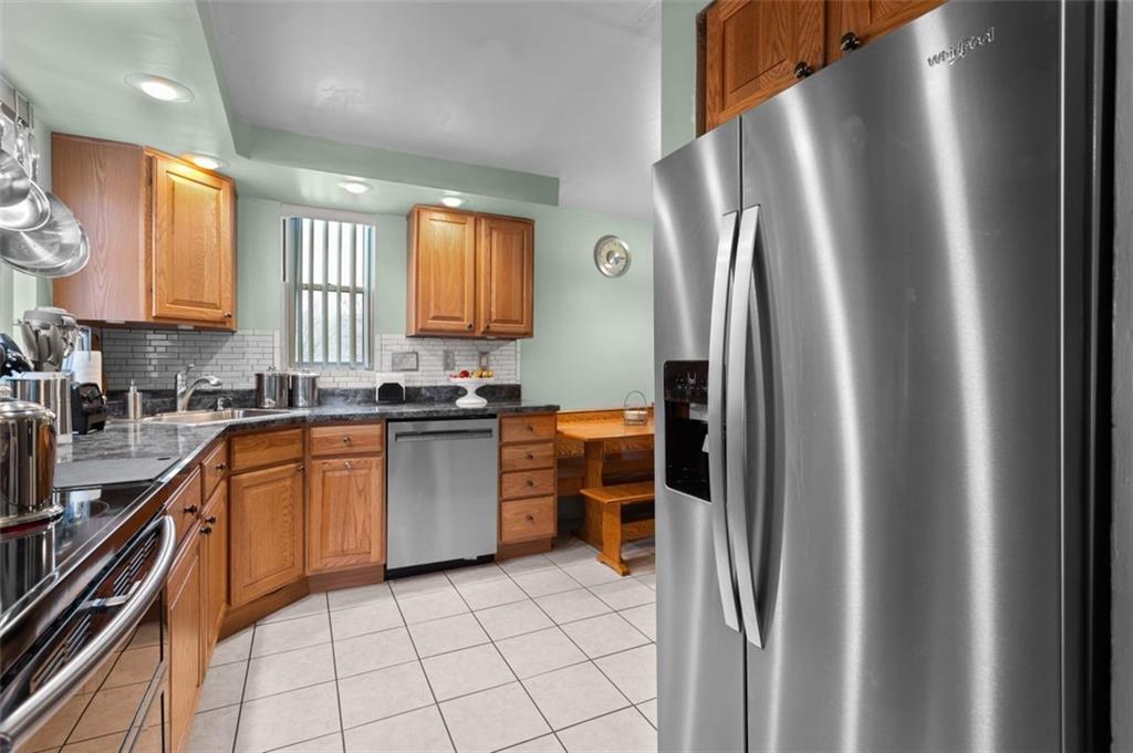 812 Rolling Rock Road Pittsburgh, PA 15234 - Photo 10 of 24 View of the kitchen from the dining room side.