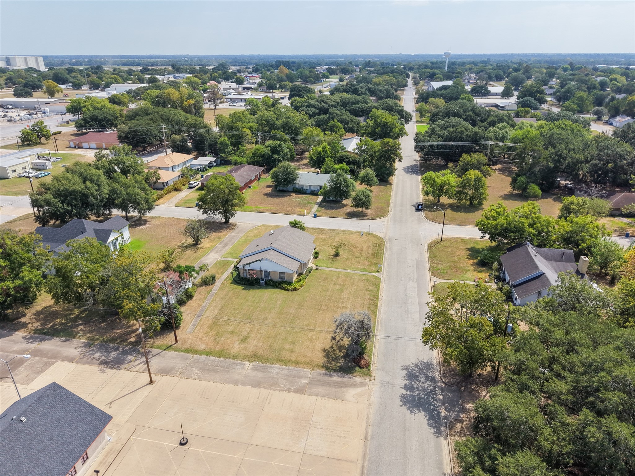 810 Main Street Hempstead, TX 77445 - Photo 6 of 32 Aerial view looking across the property and neighborhood, showcasing the lot size and central Hempstead location.