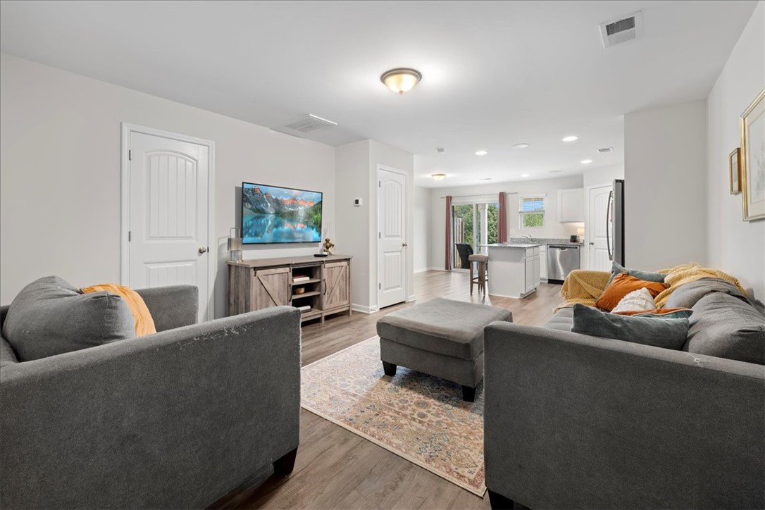 117 Adger Road Pendleton, SC 29670 - Photo 4 of 36 An inviting open-concept living space features warm flooring and ample natural light.