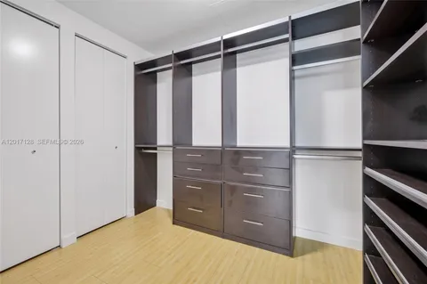 a room with closet and wooden floor