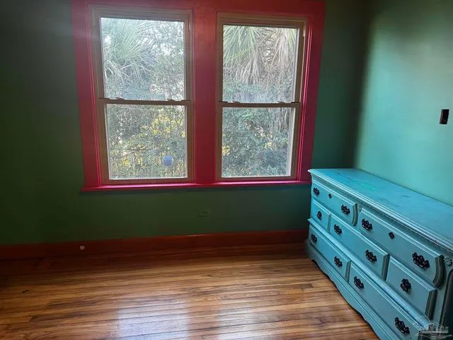 wooden floor and window in a room