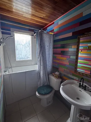 a bathroom with a sink and toilet