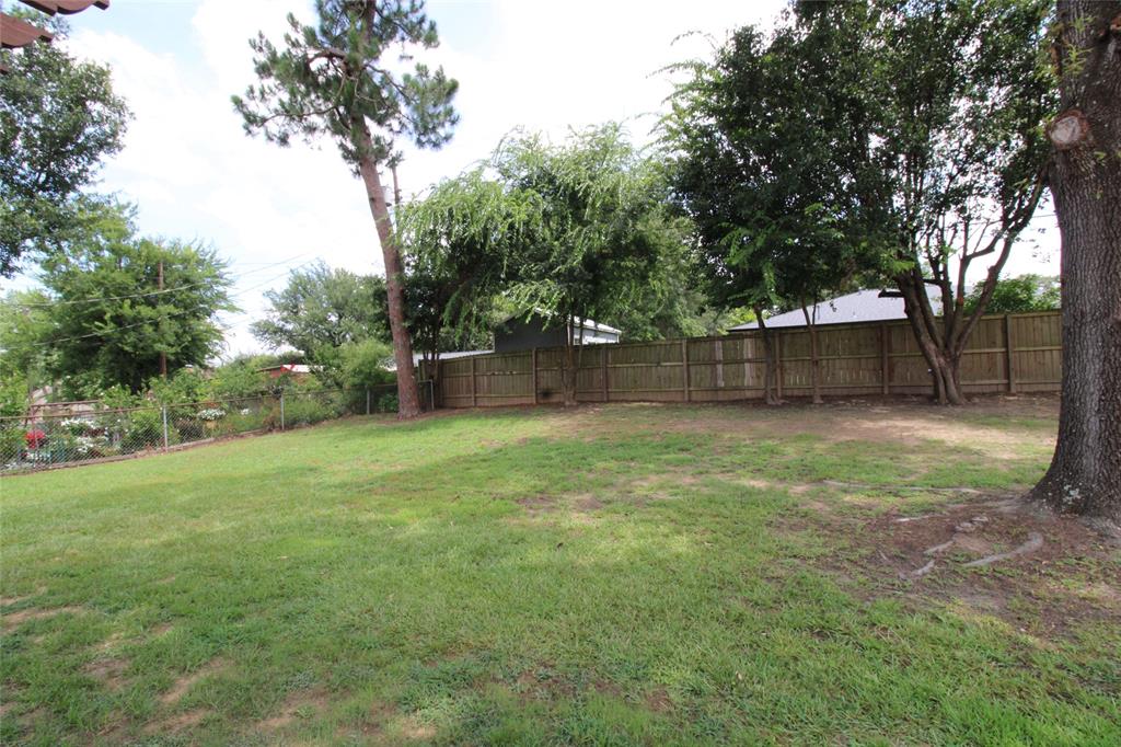 818 East Clinton Avenue Athens, TX 75751 - Photo 24 of 24 a view of a backyard with a trees