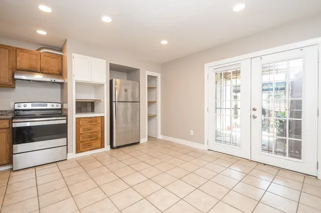 a view of wooden floor and windows in a room