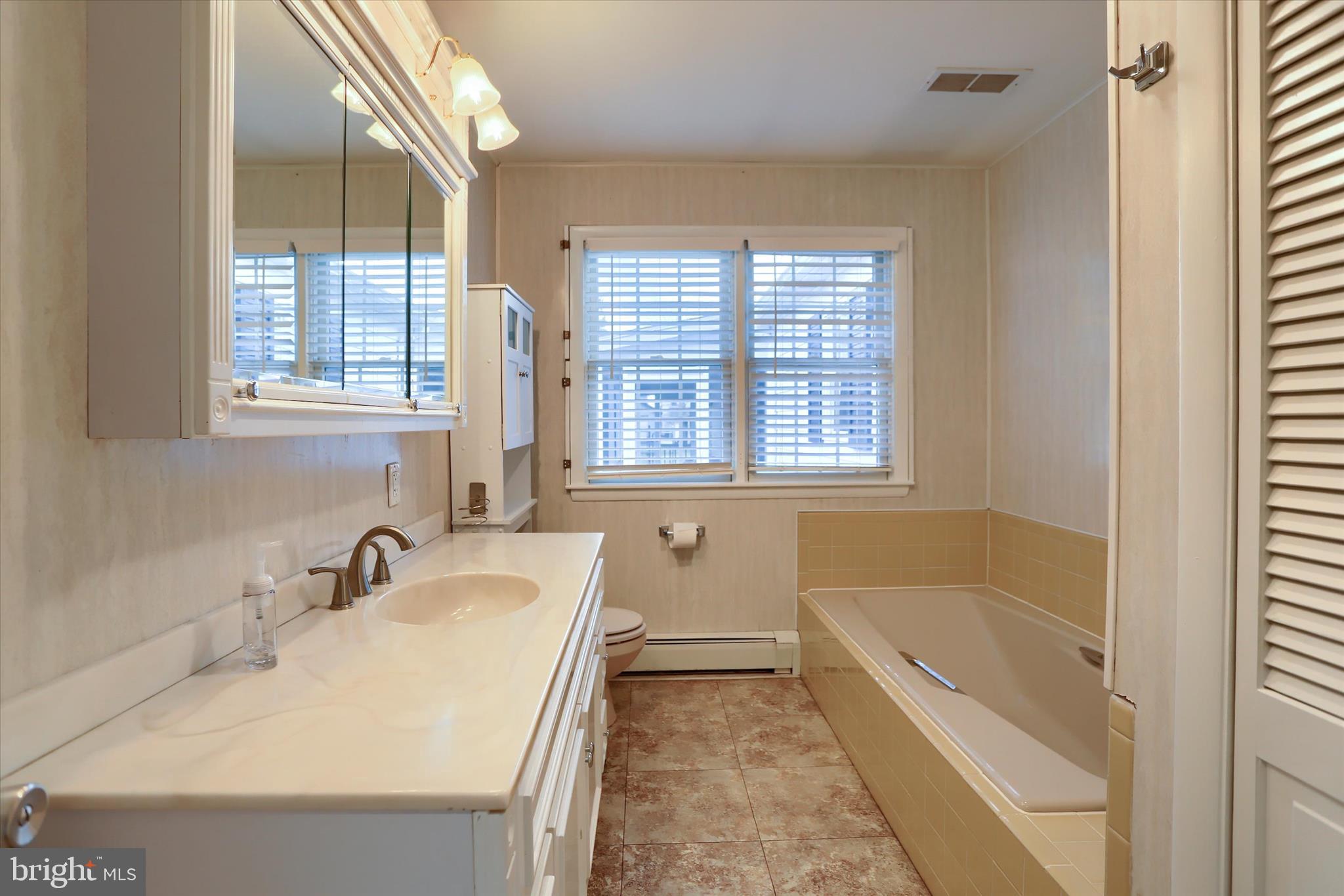 302 Park Road Valley View, PA 17983 - Photo 20 of 59 a bathroom with a tub sink and mirror