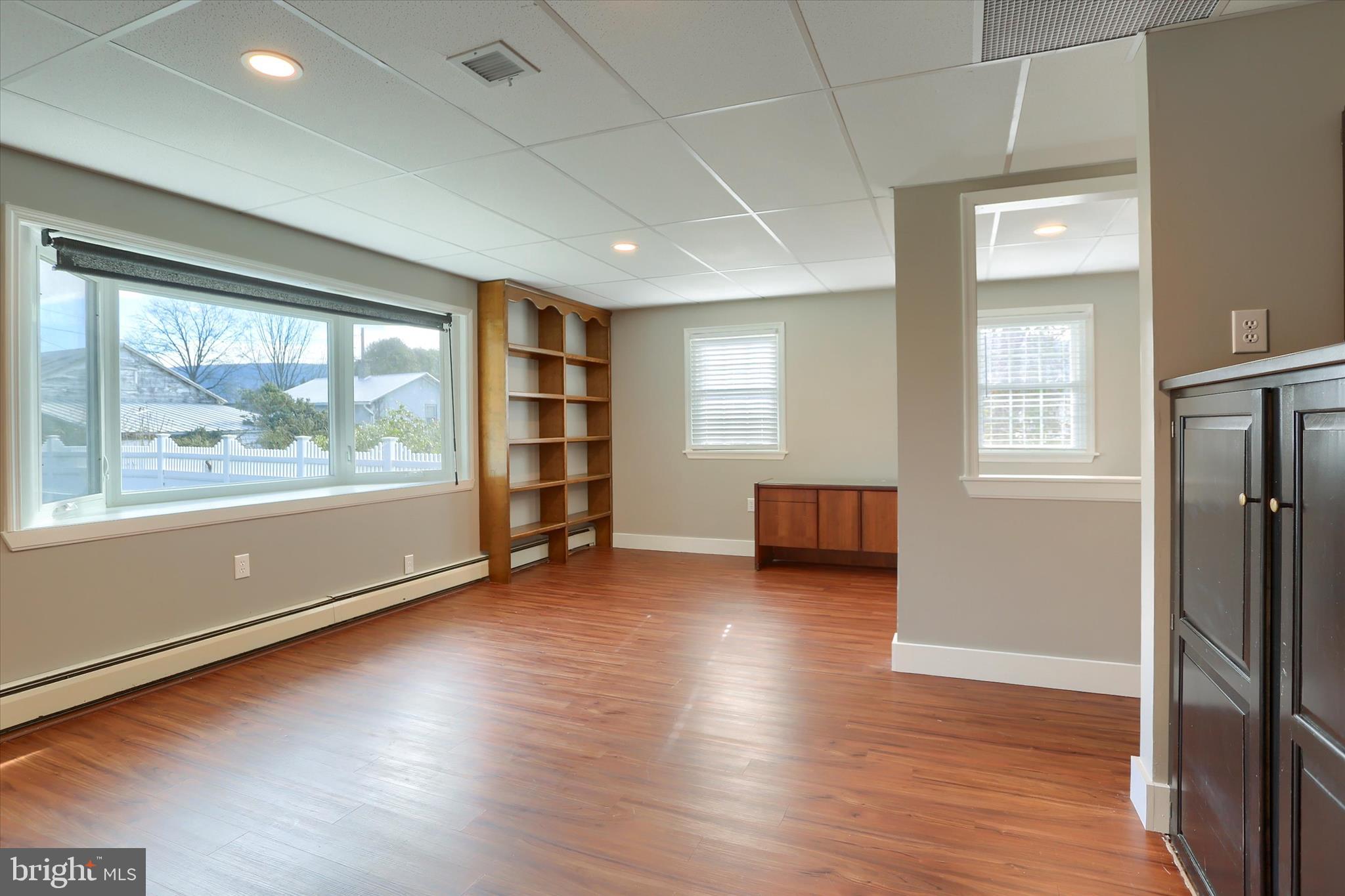 302 Park Road Valley View, PA 17983 - Photo 28 of 59 an empty room with wooden floor and windows