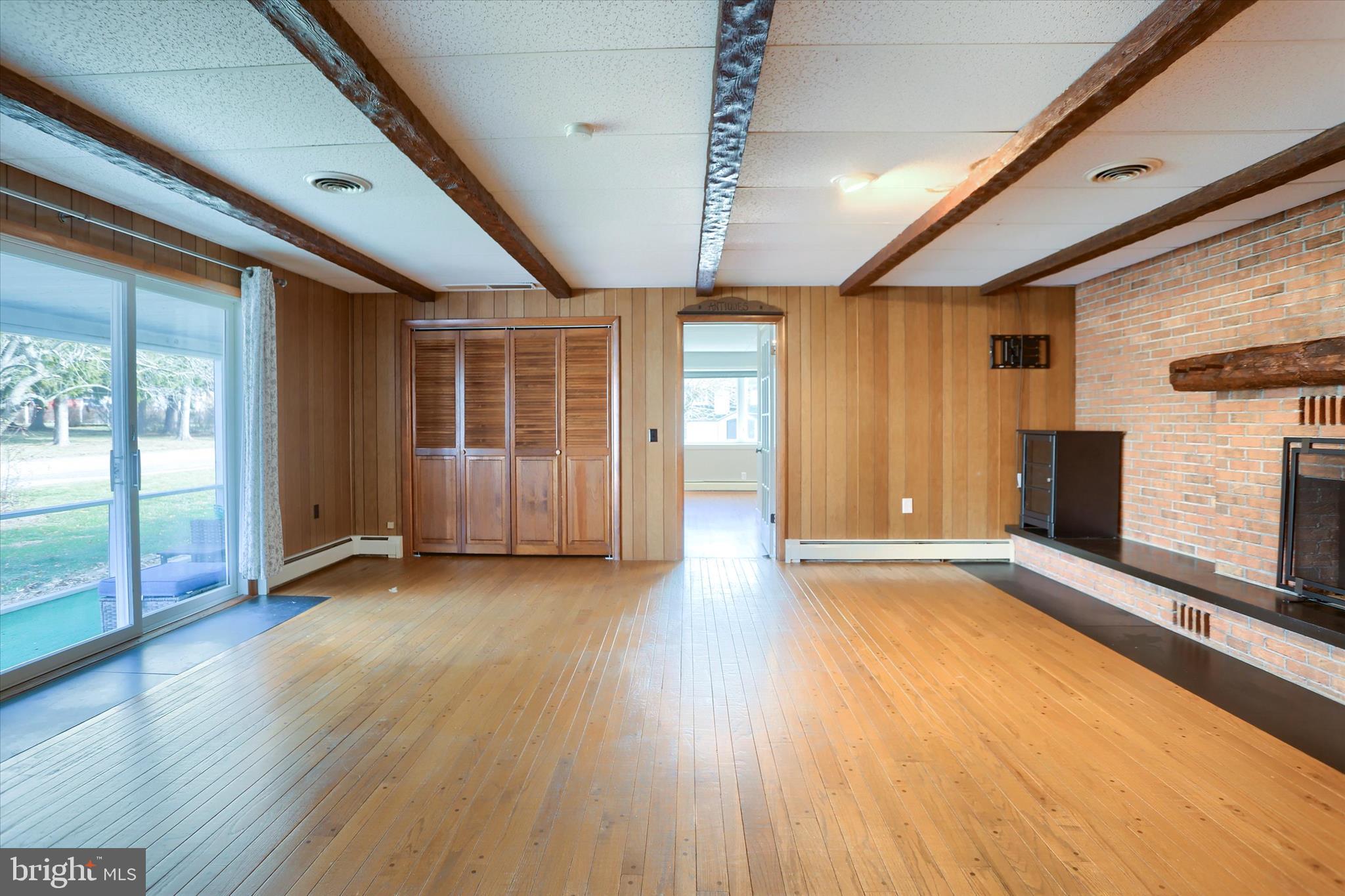 302 Park Road Valley View, PA 17983 - Photo 33 of 59 an empty room with wooden floor and windows