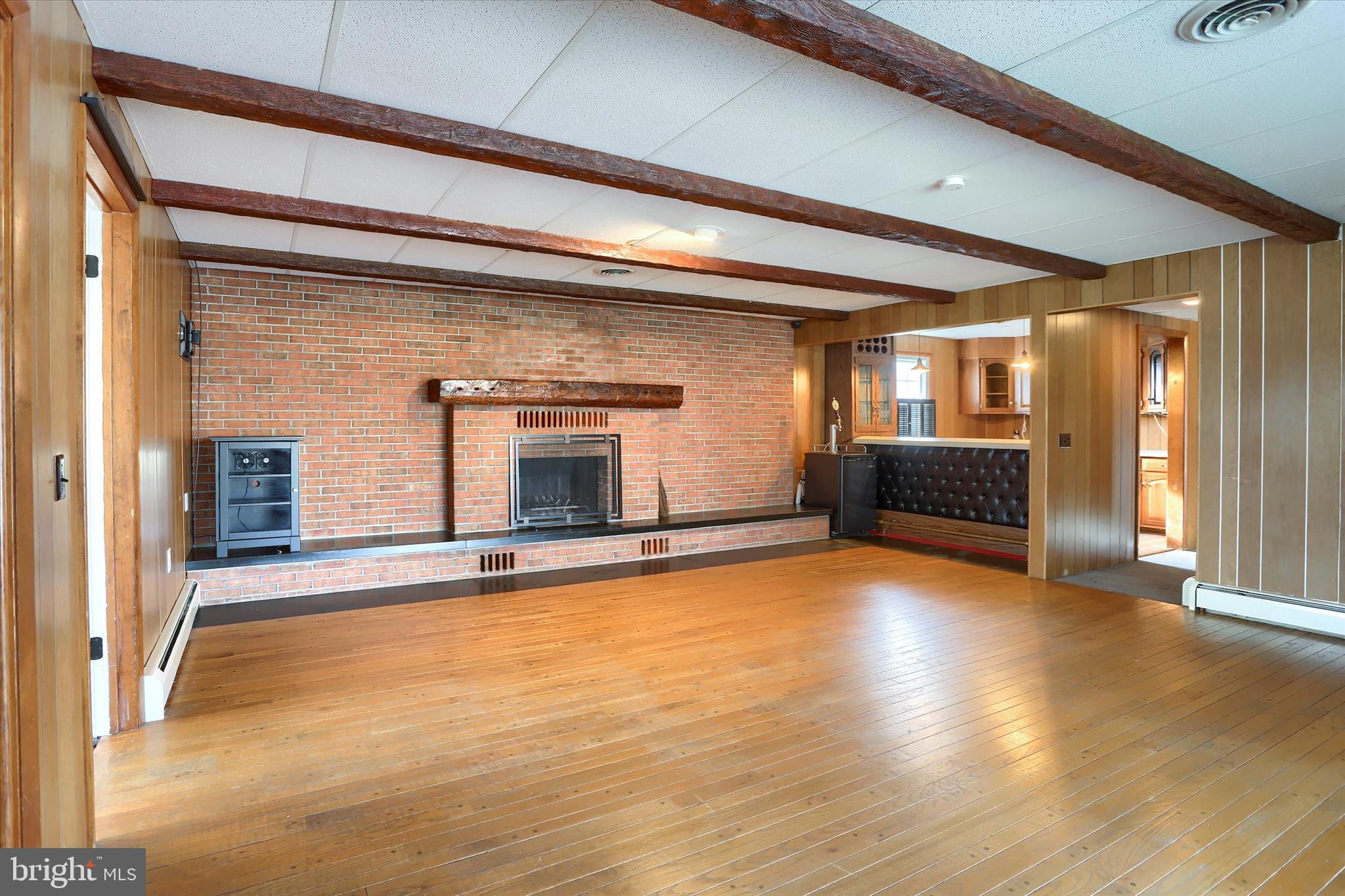 302 Park Road Valley View, PA 17983 - Photo 36 of 59 a view of empty room with wooden floor and fireplace