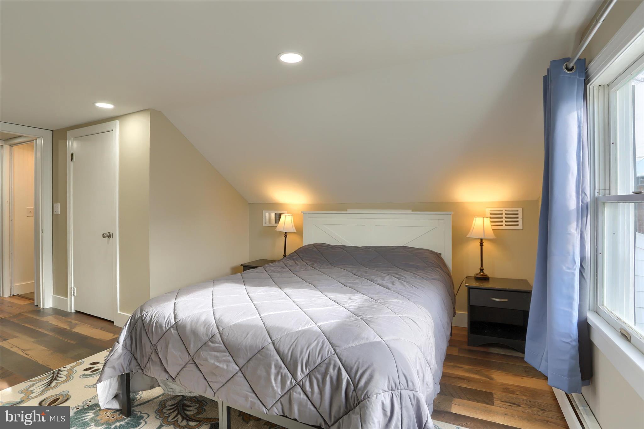 302 Park Road Valley View, PA 17983 - Photo 43 of 59 a bedroom with a bed and a lamp