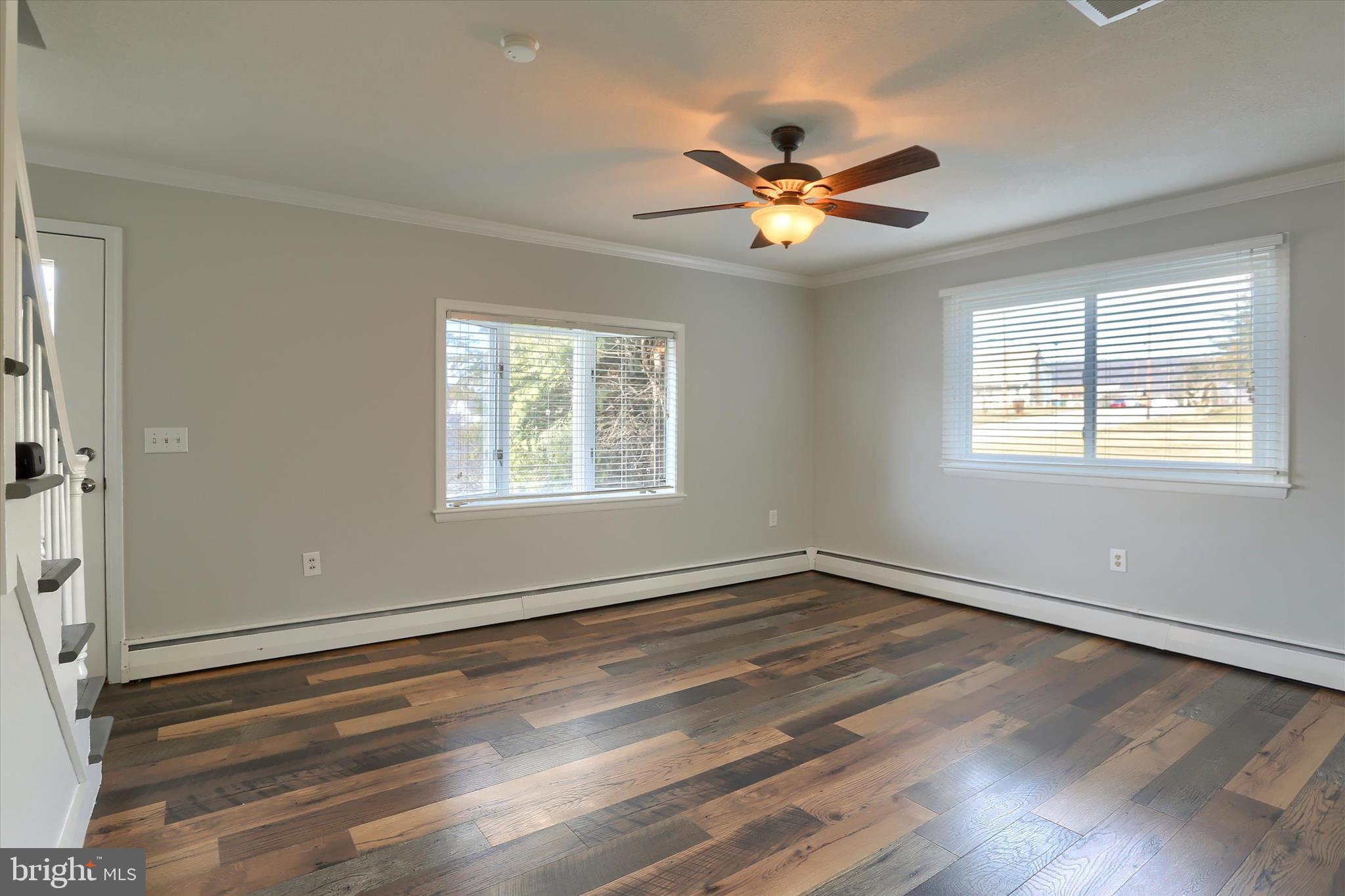 302 Park Road Valley View, PA 17983 - Photo 7 of 59 a view of an empty room with wooden floor and a window