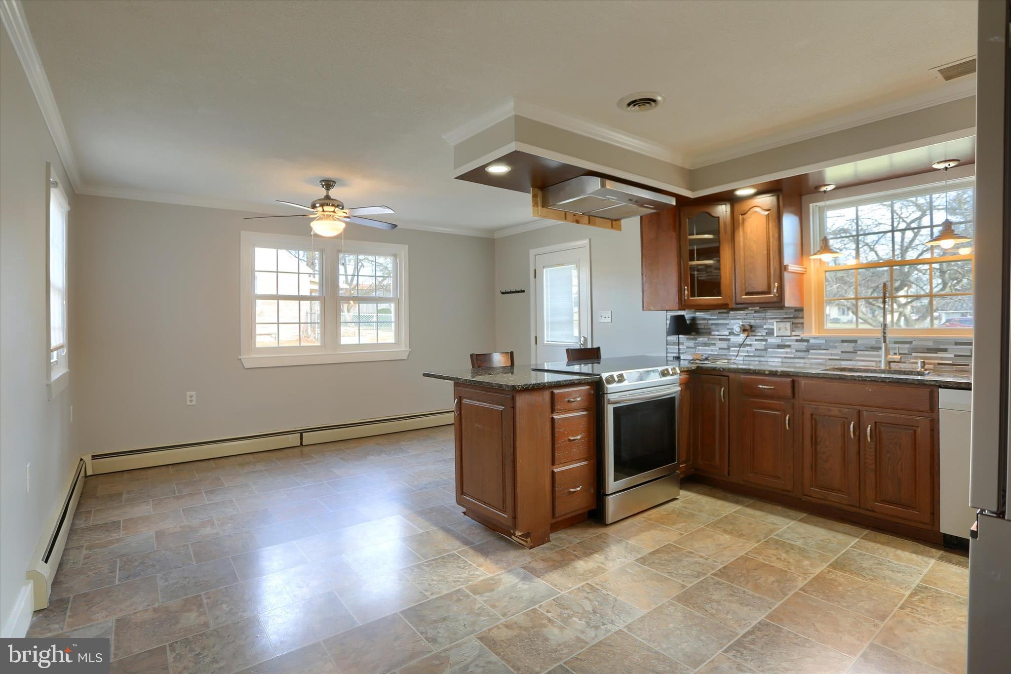302 Park Road Valley View, PA 17983 - Photo 8 of 59 a kitchen with stainless steel appliances granite countertop a stove a sink and a refrigerator